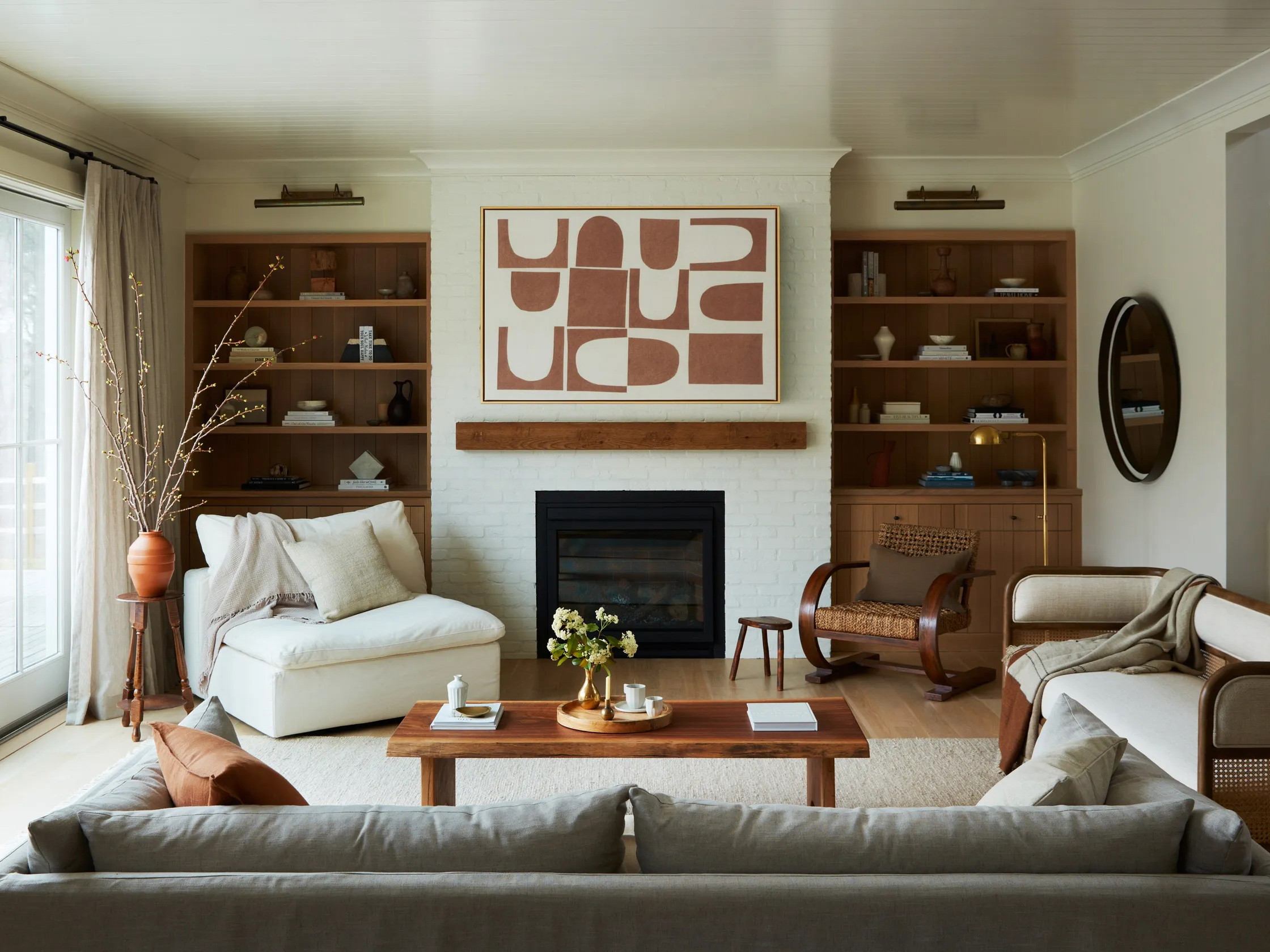 a living room filled with furniture and a fire place