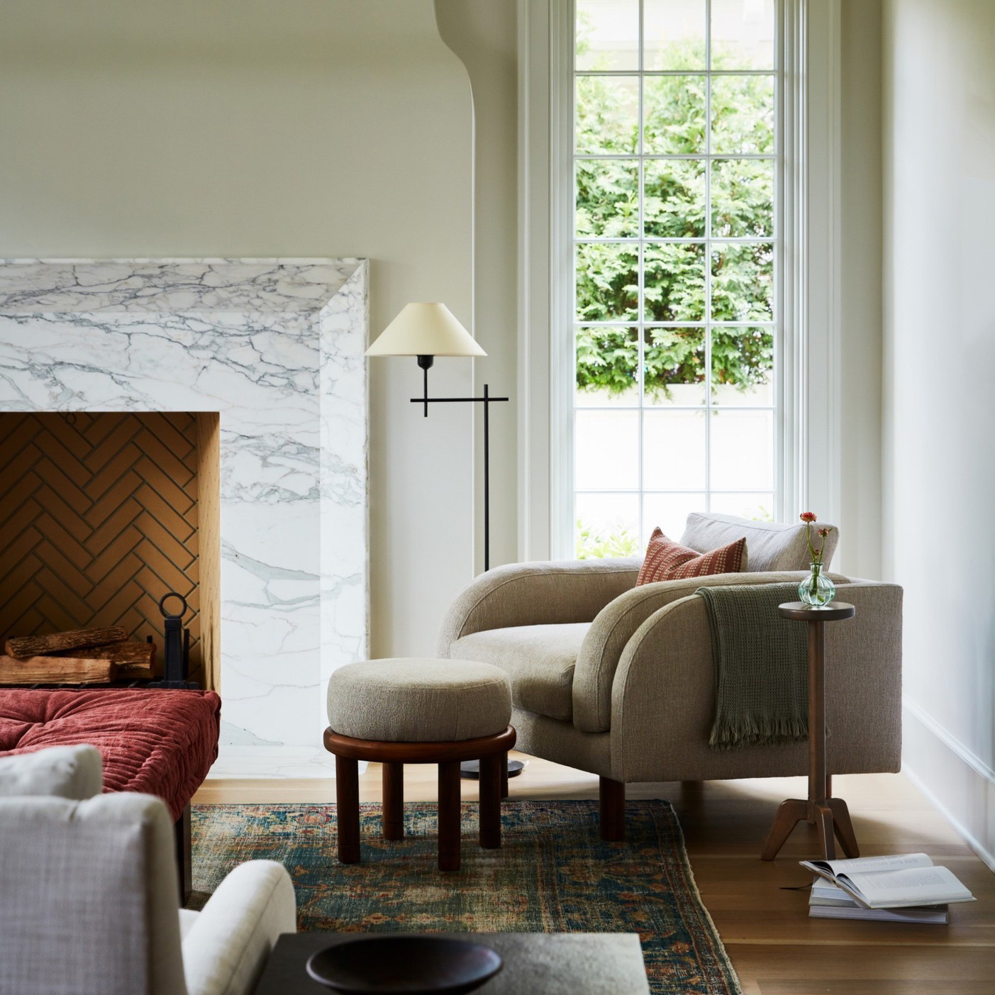 a living room filled with furniture and a fire place