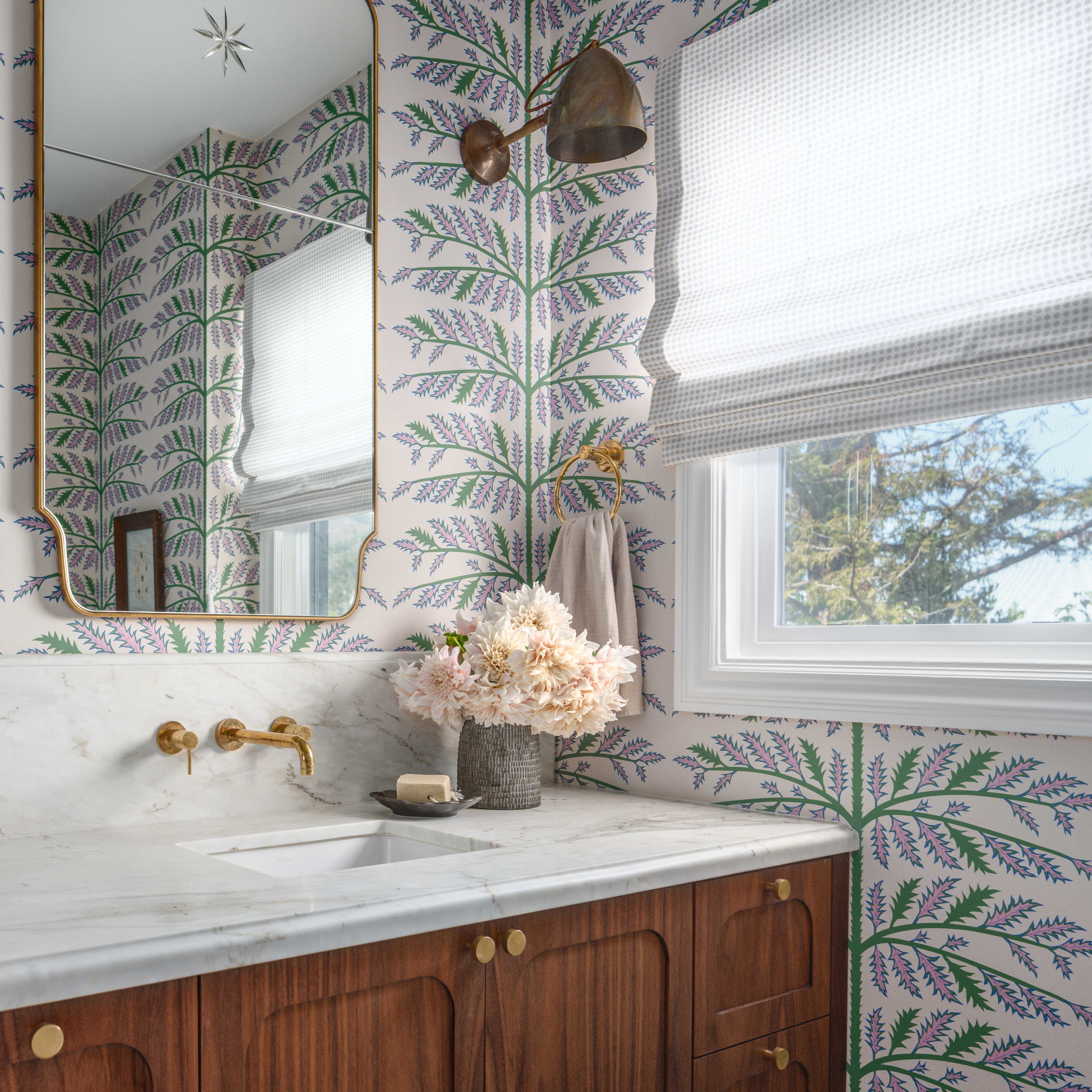 a bathroom with a large mirror and a sink