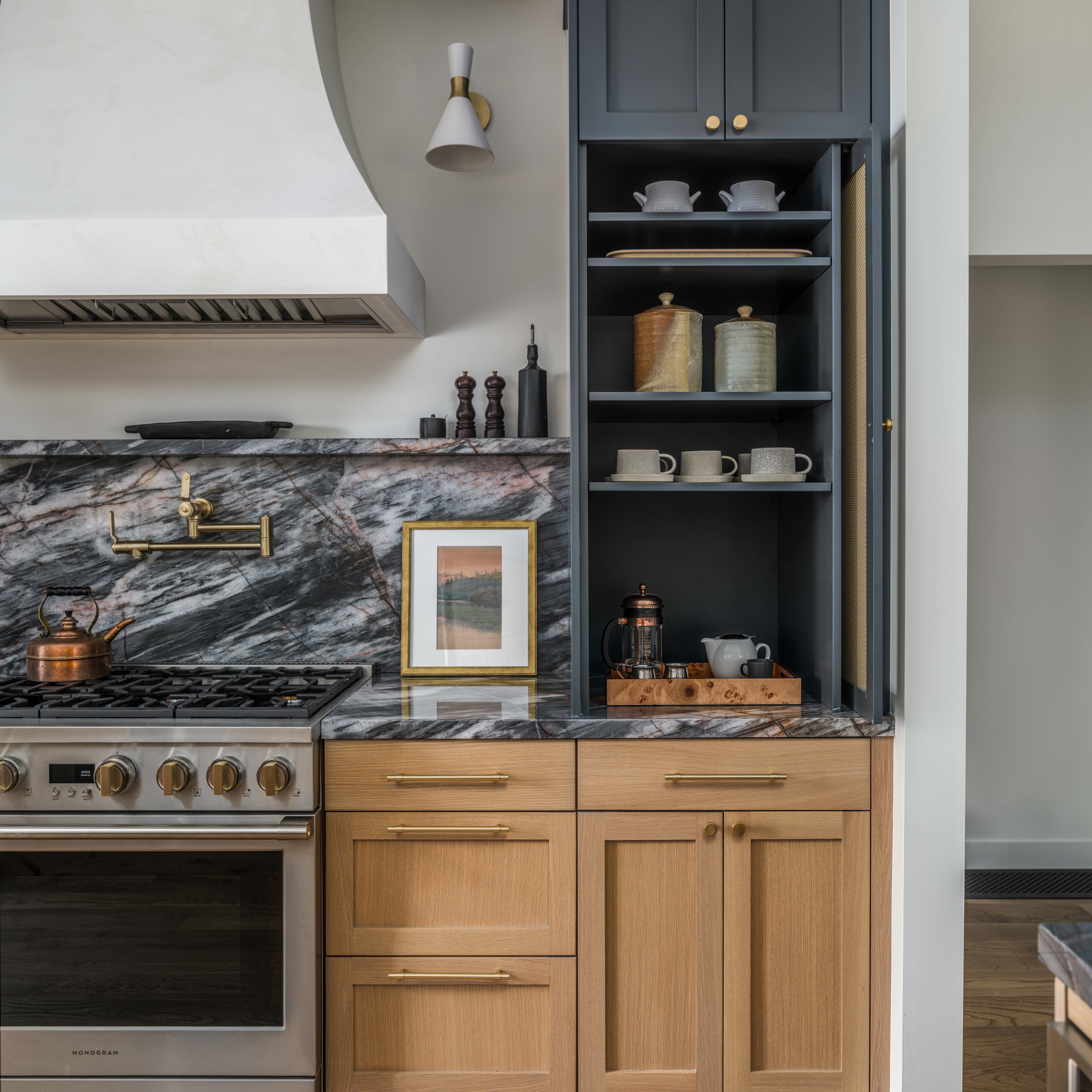 a kitchen with a stove, oven and cabinets