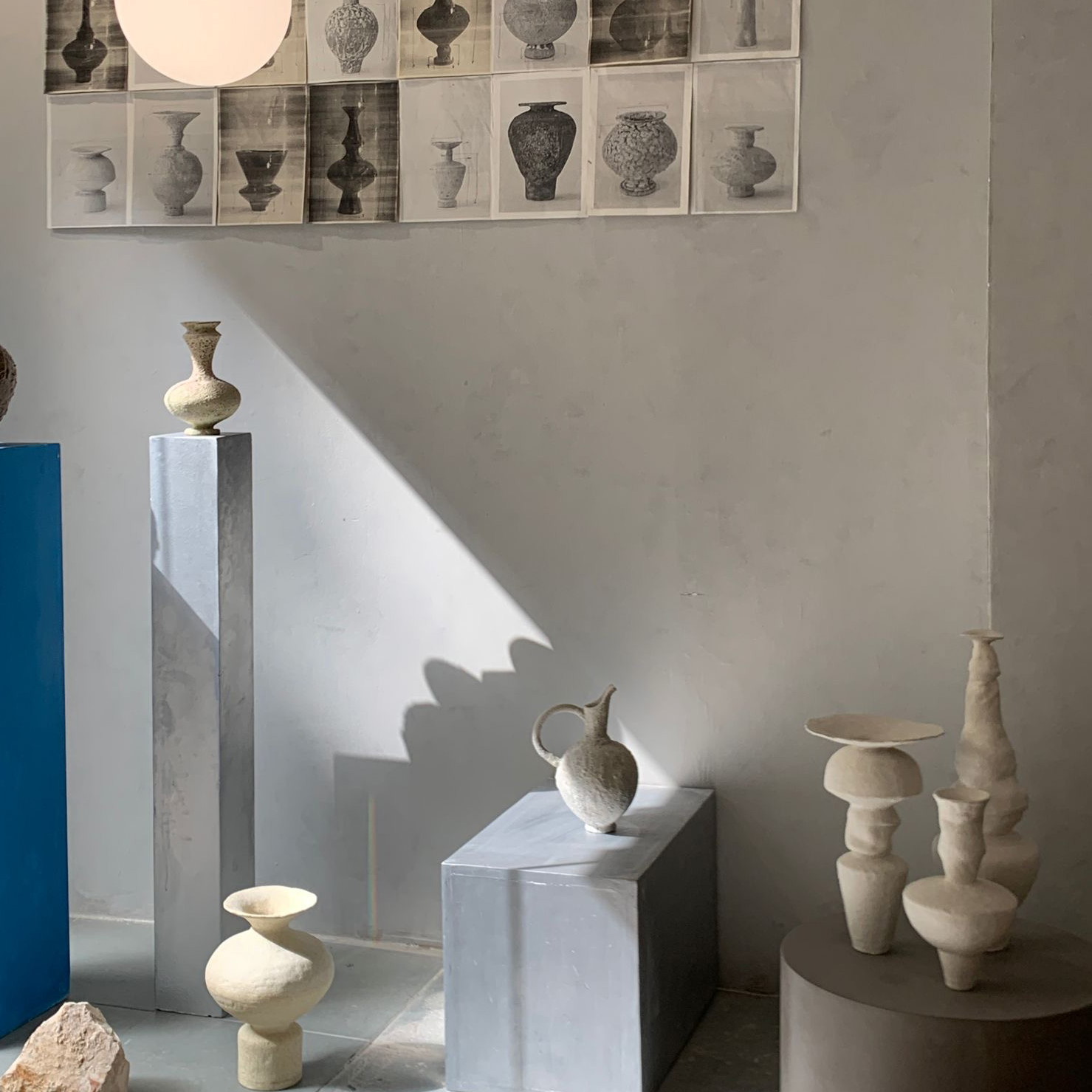 a number of vases on display in a room