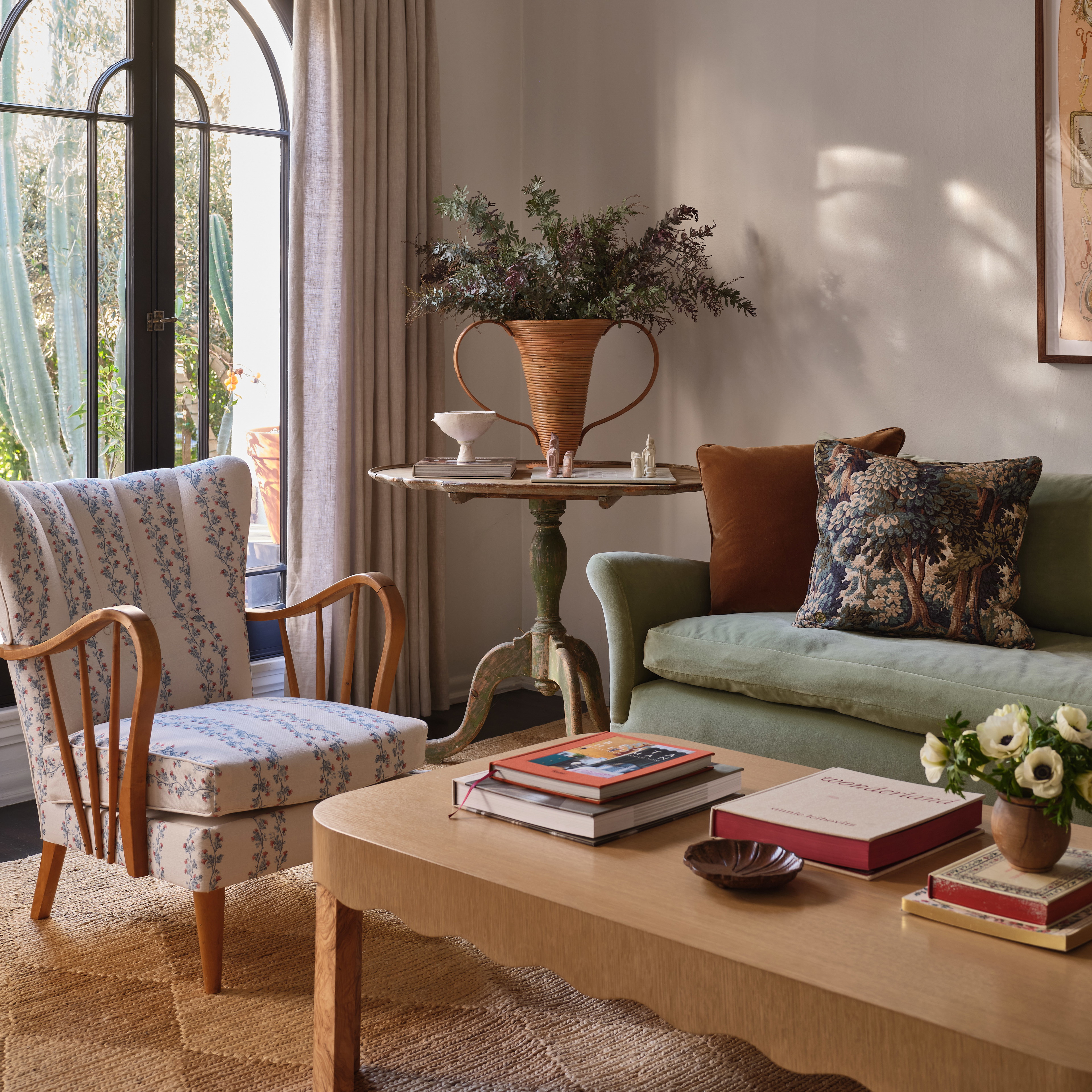 a living room filled with furniture and a large window