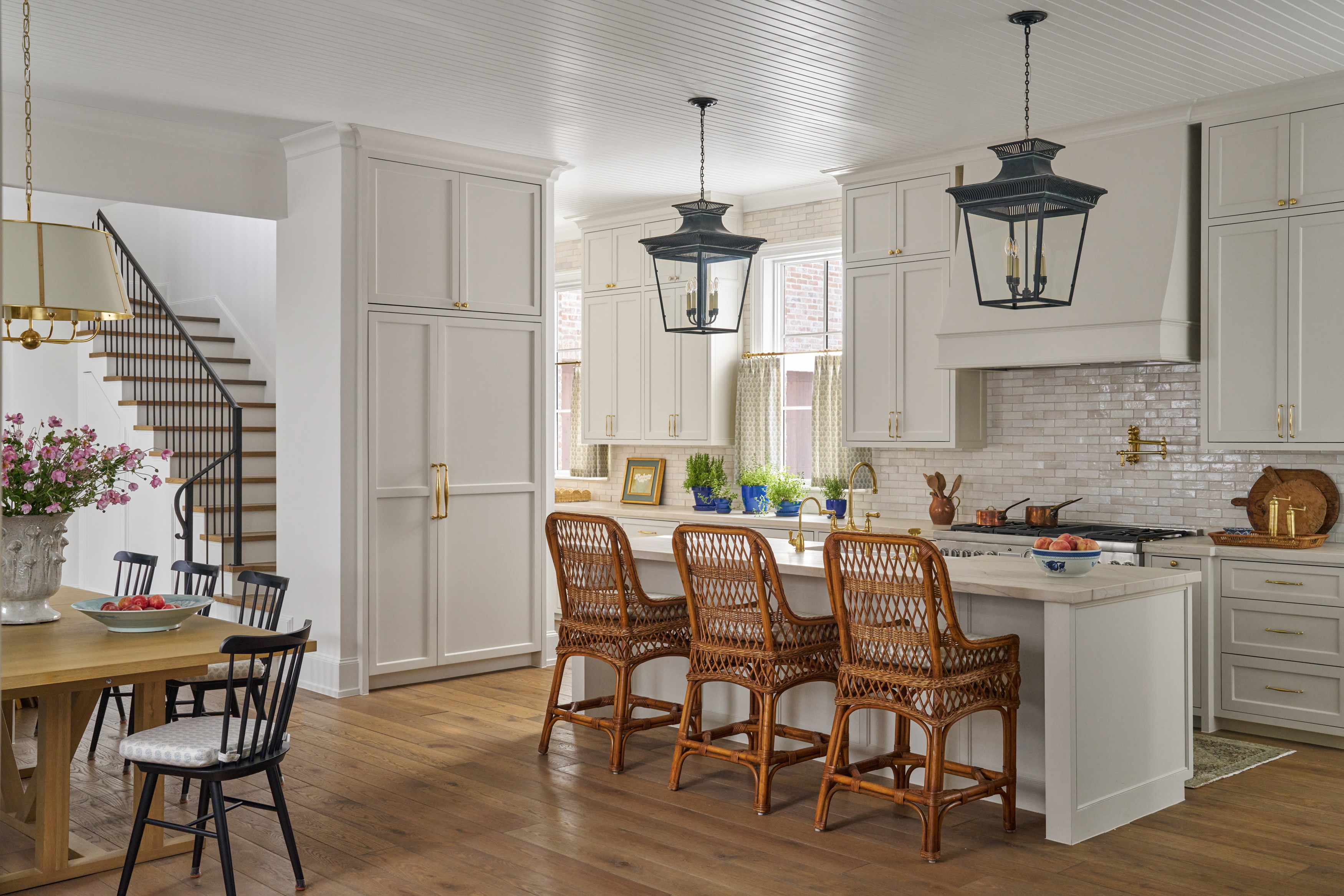 a kitchen with a wooden table and chairs