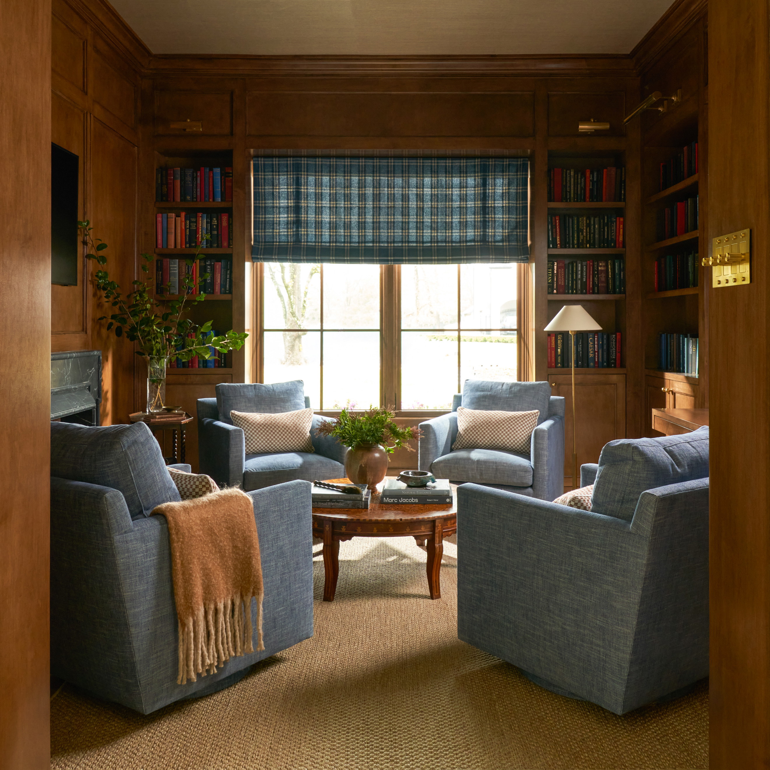 a living room filled with furniture and a window