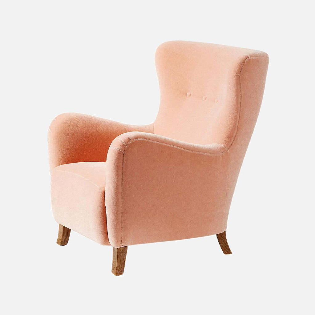 a pink chair on a white background
