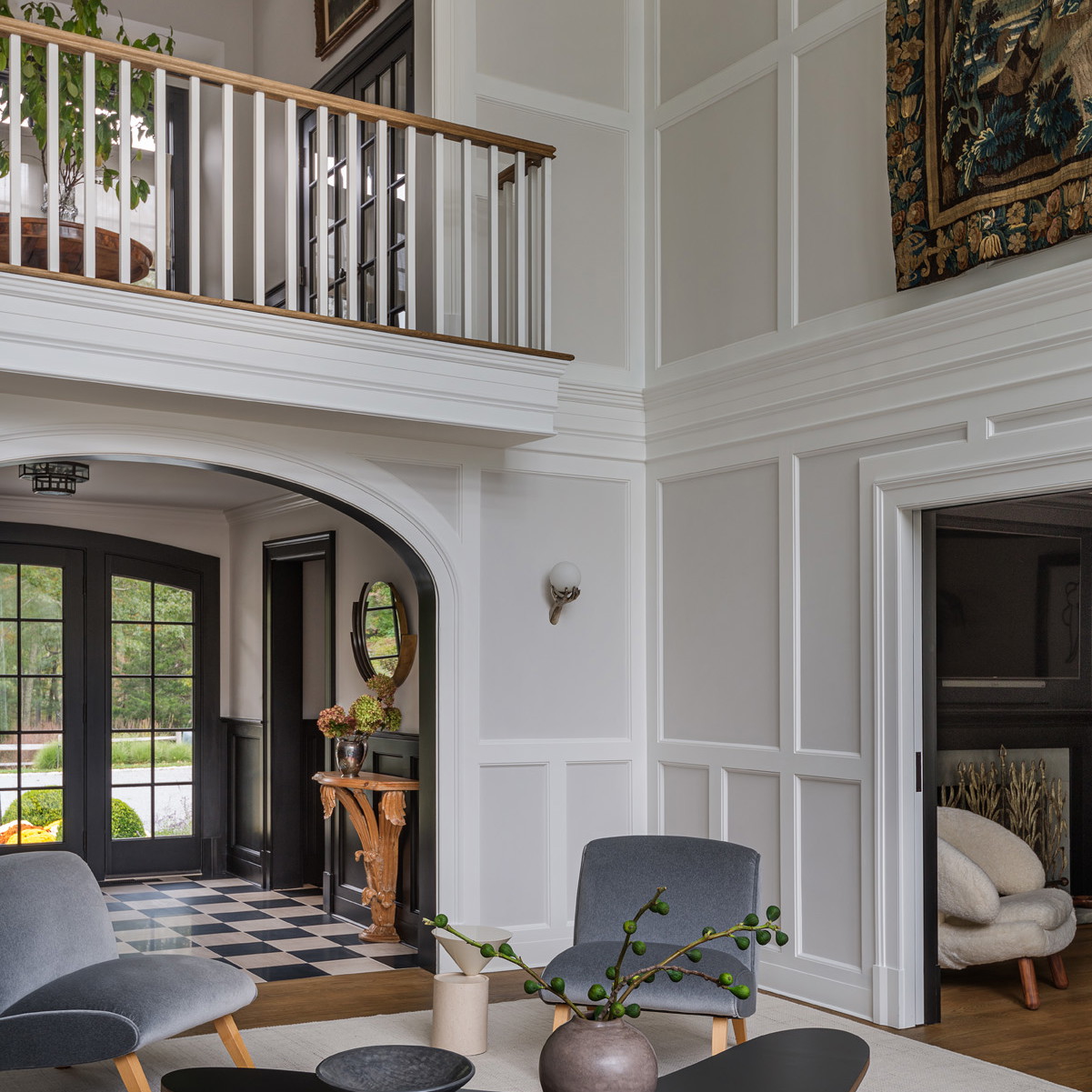 a living room filled with furniture and a staircase