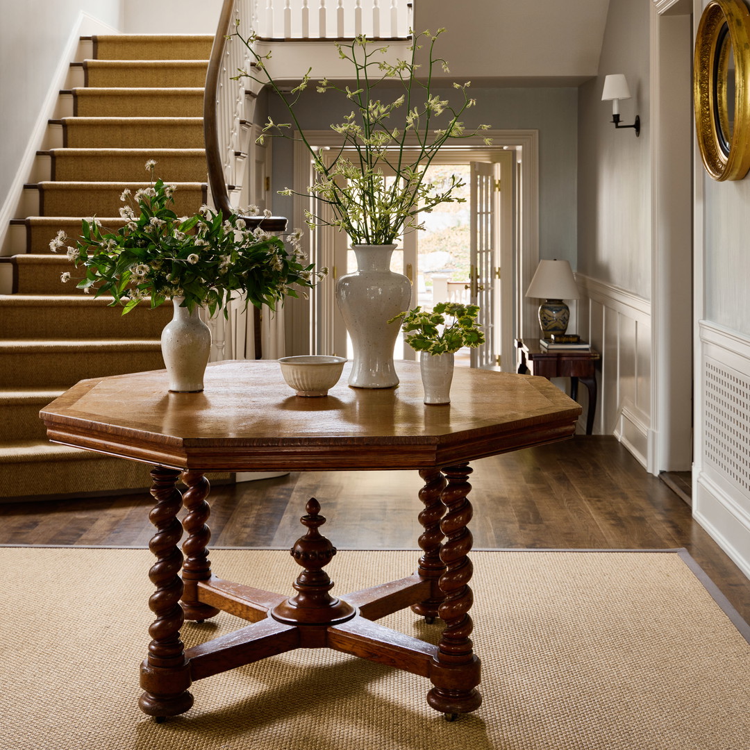 a table with vases of flowers on top of it