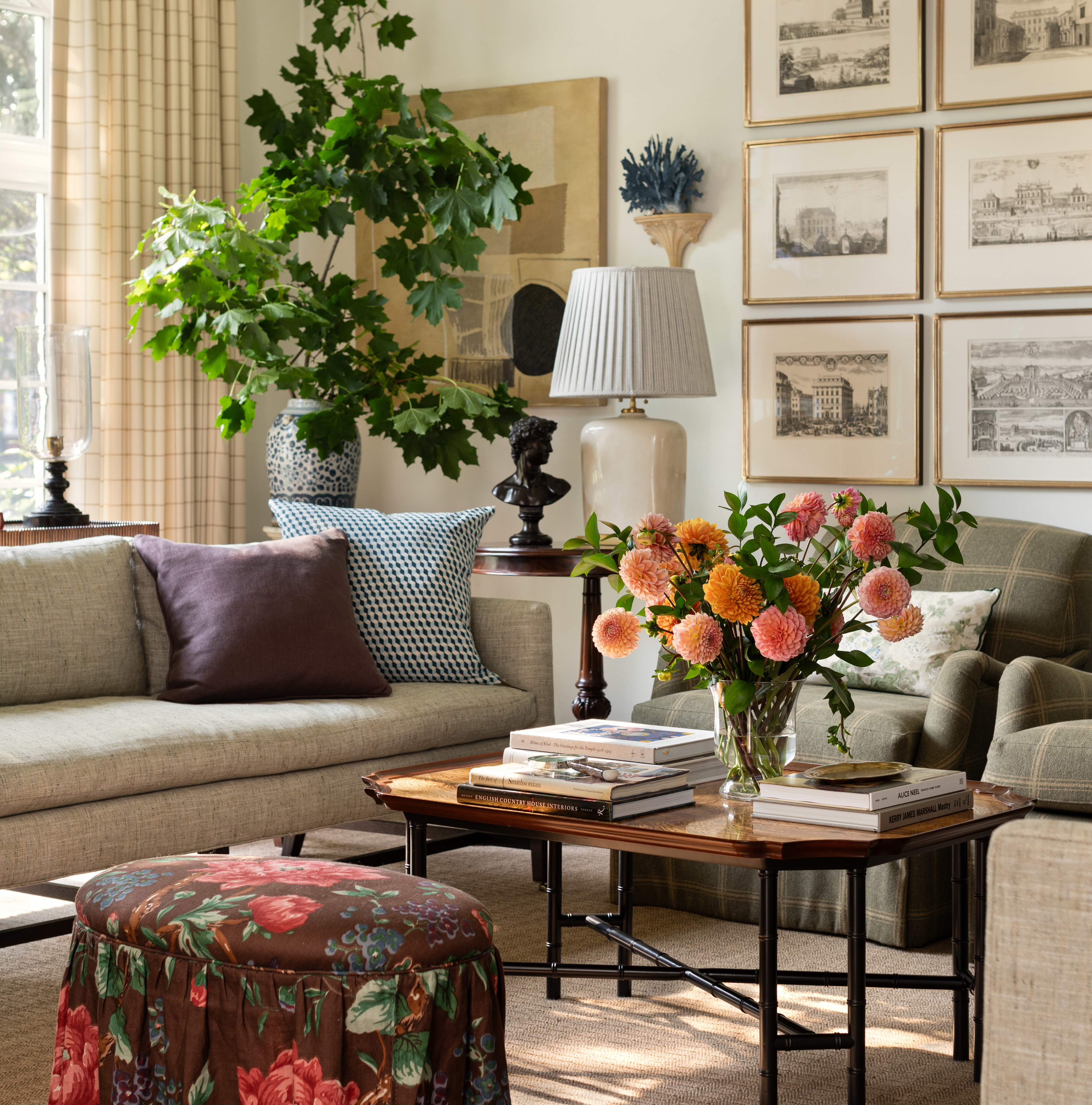 a living room filled with furniture and flowers