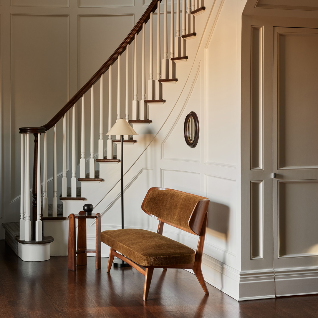 a chair and a lamp in a room