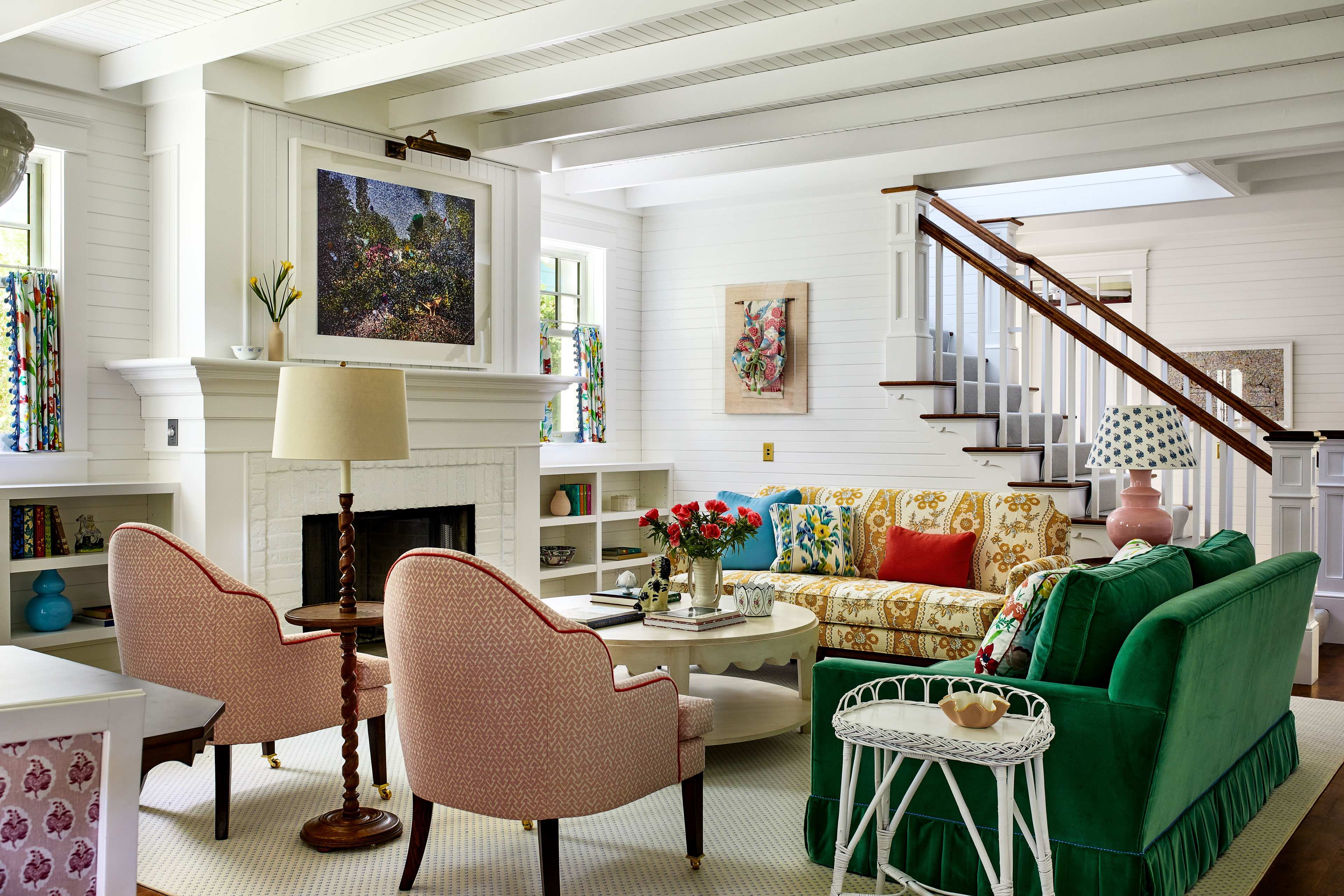 a living room filled with furniture and a fire place