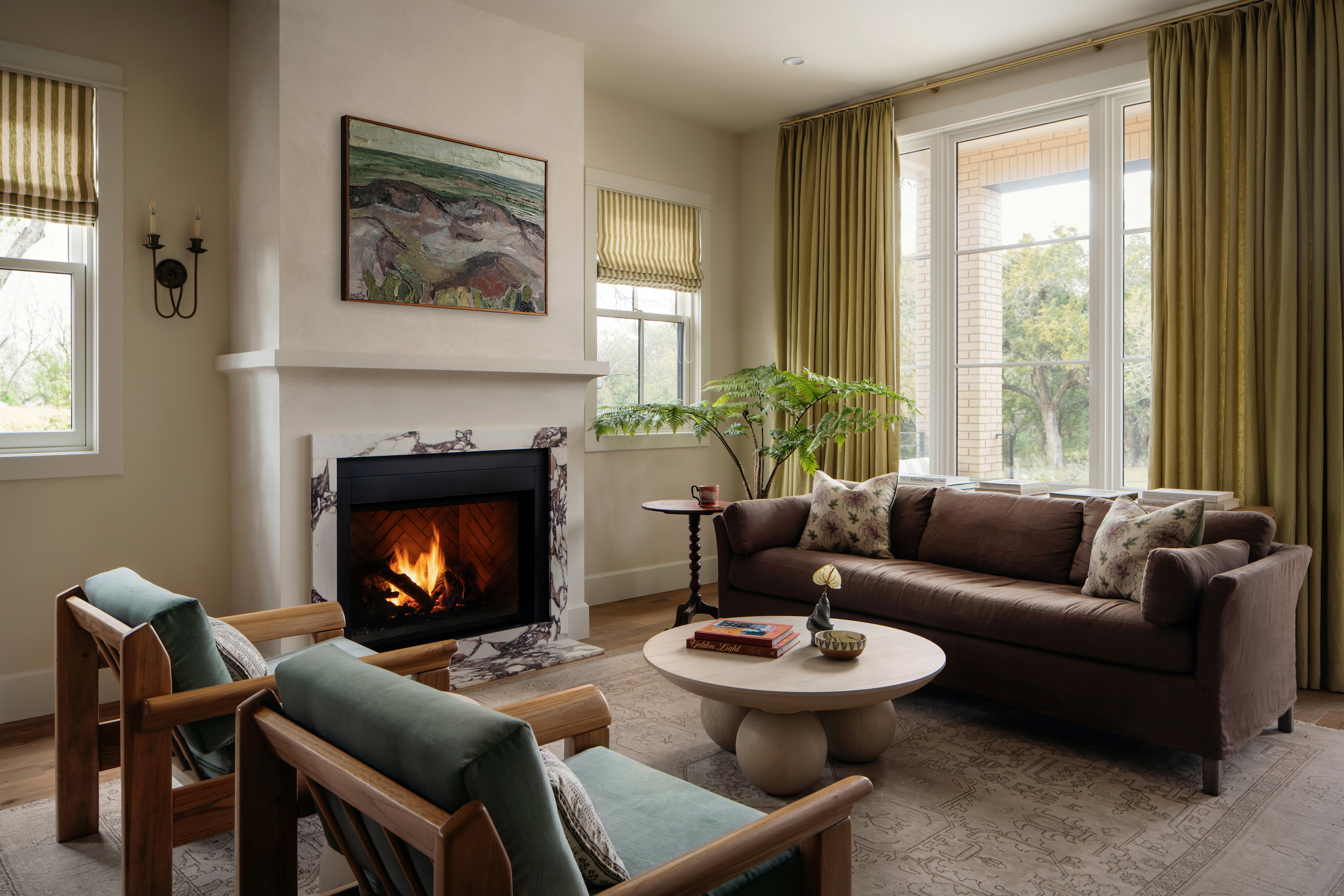 a living room filled with furniture and a fire place