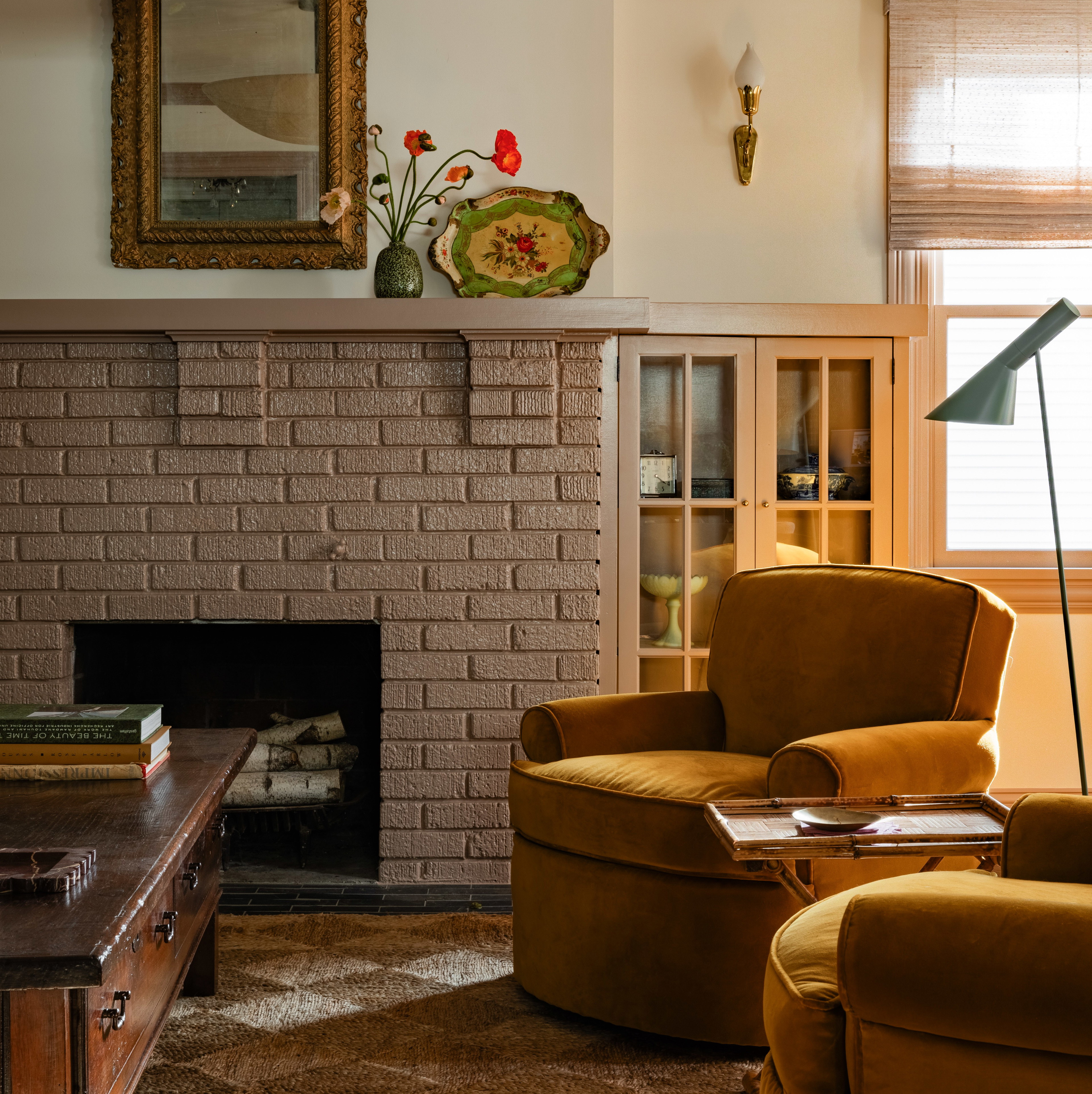 a living room filled with furniture and a fire place