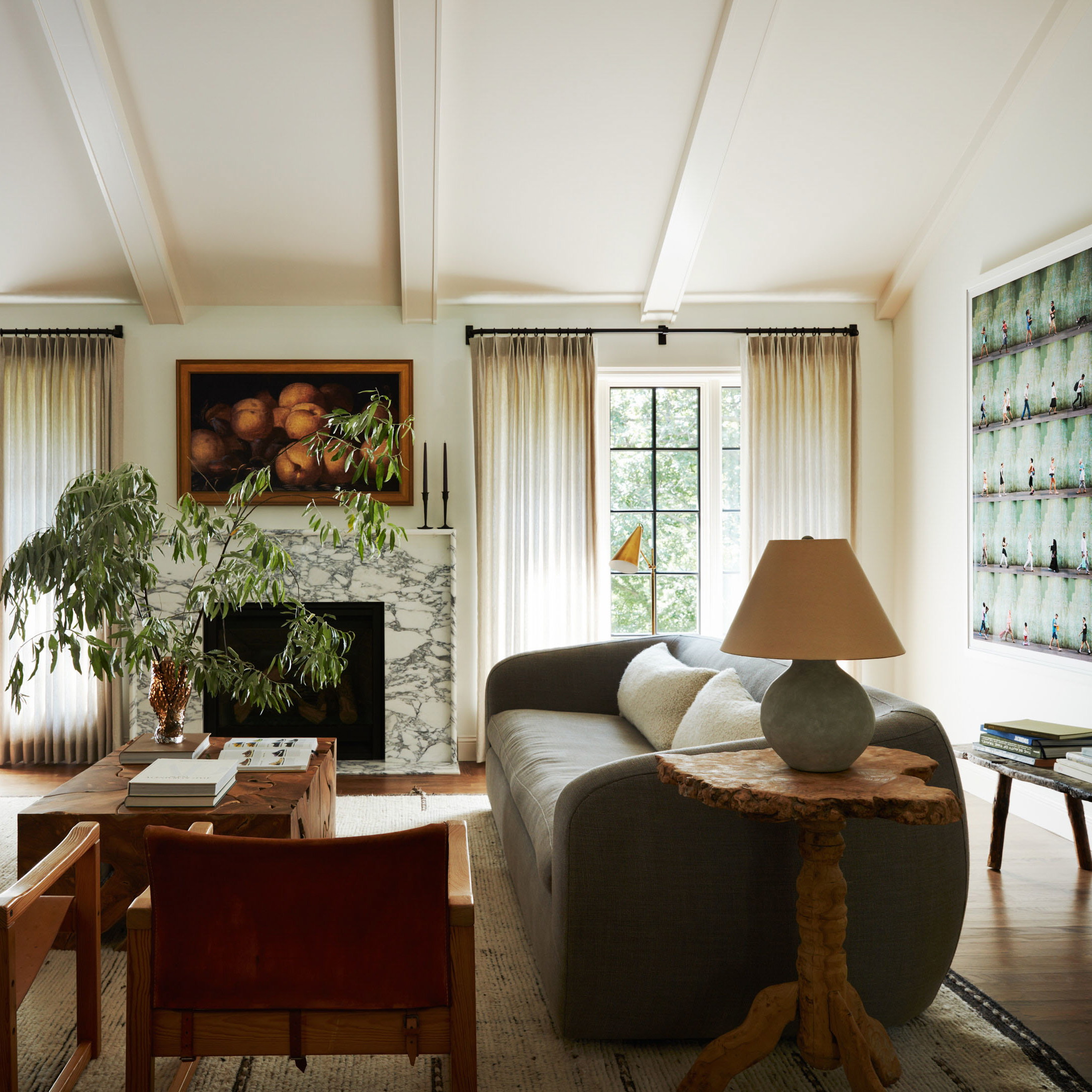 a living room filled with furniture and a fire place