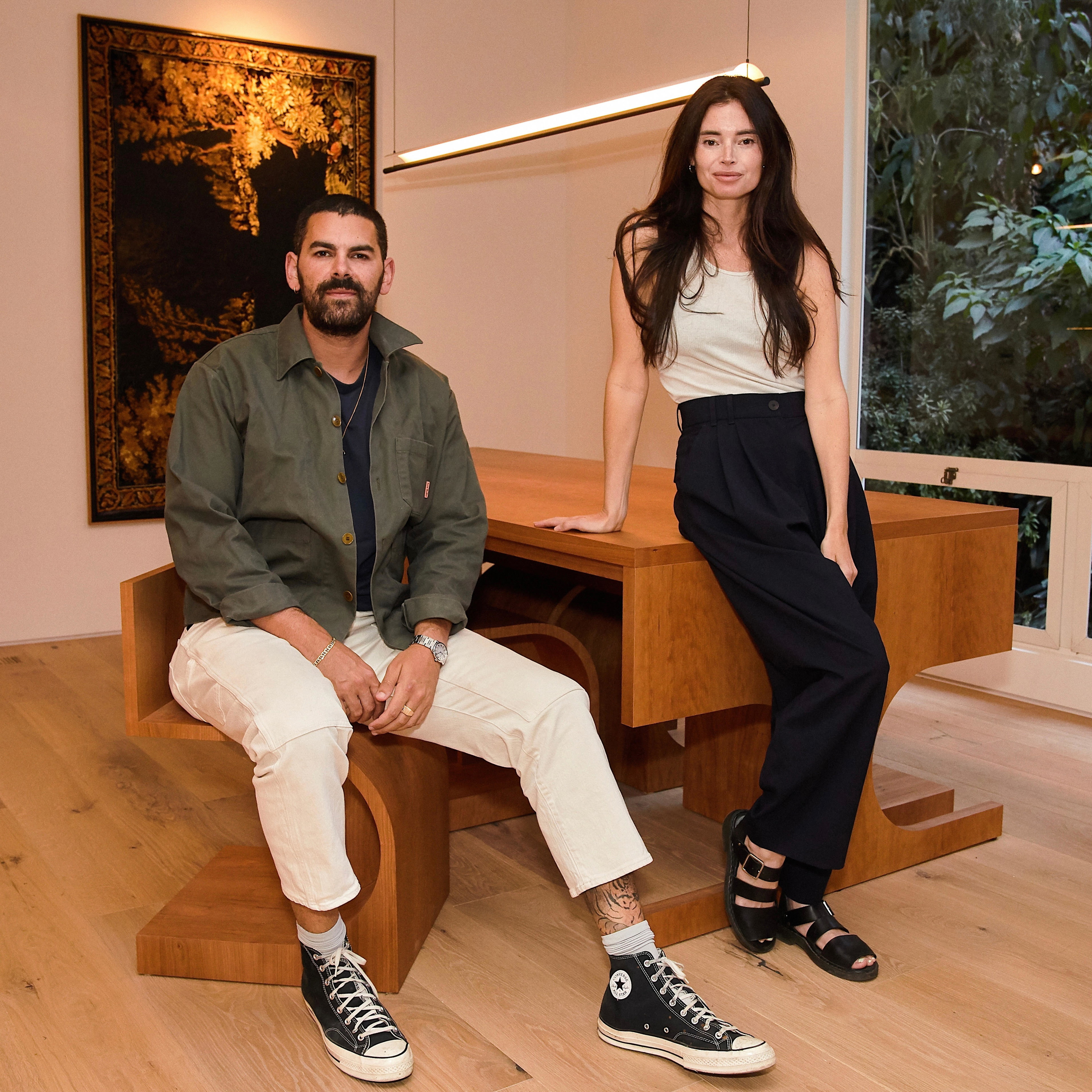 a man and a woman sitting on a bench