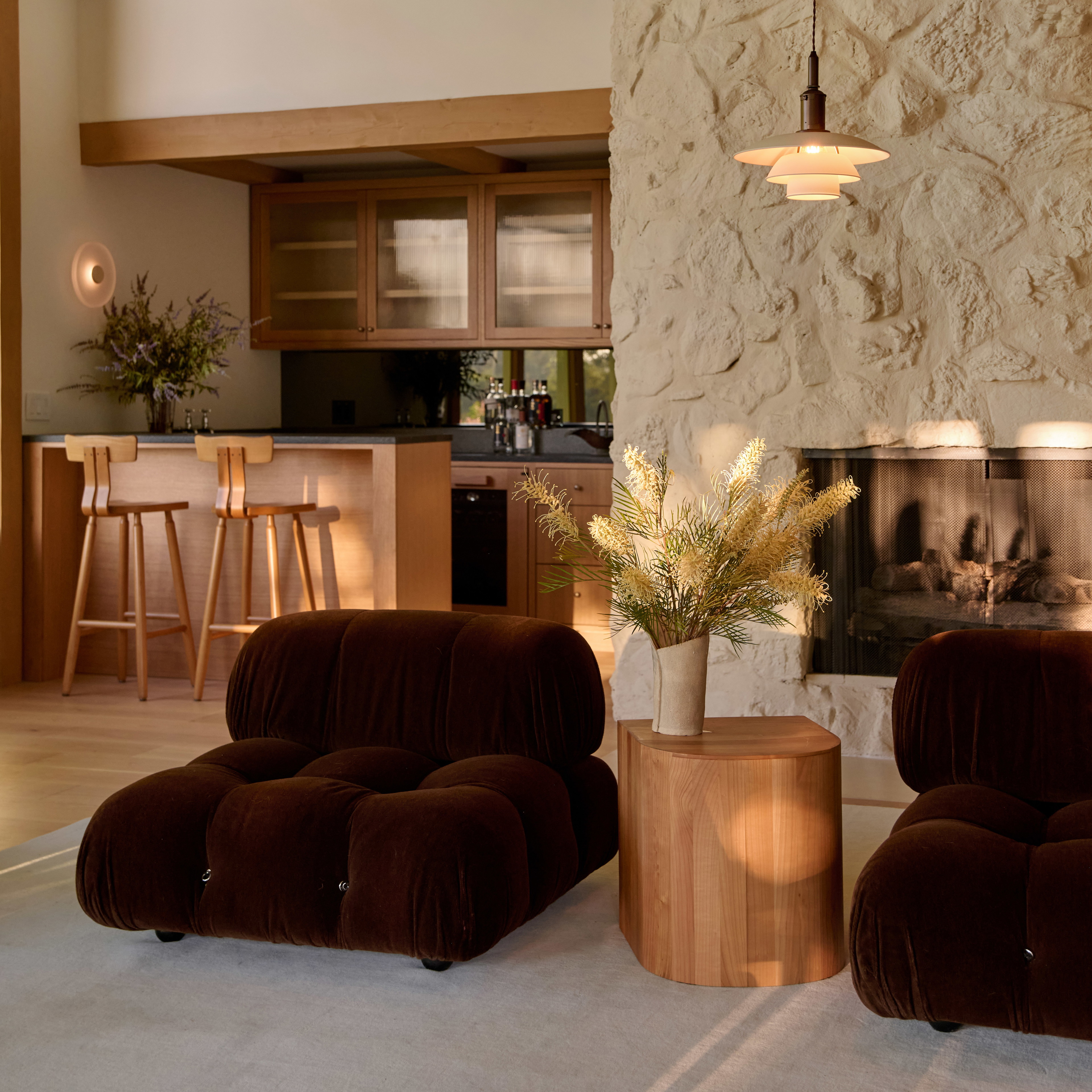 a living room filled with furniture and a fire place