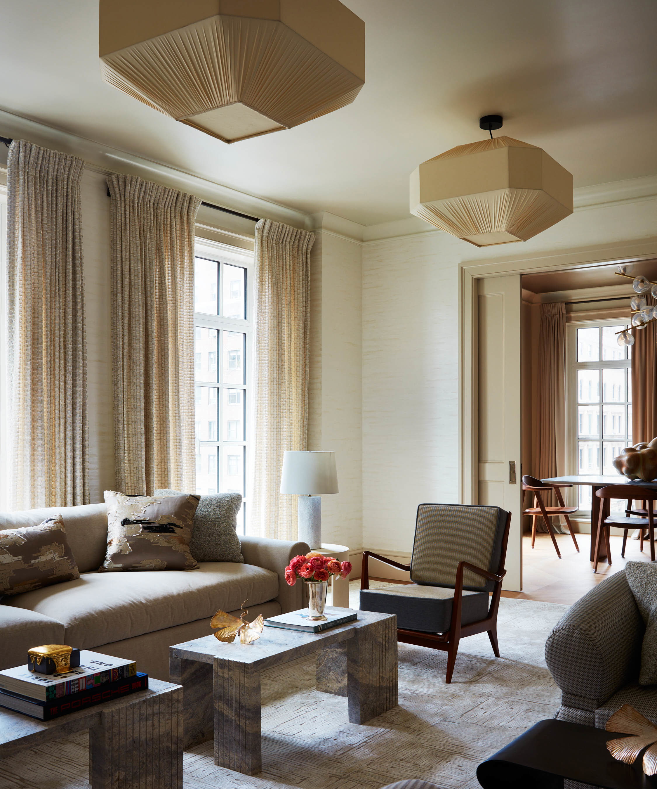 a living room filled with furniture and a large window