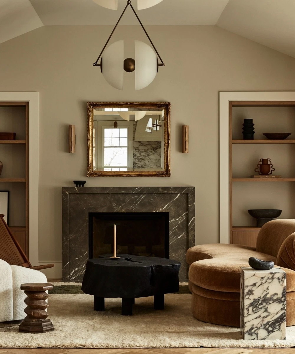 a living room filled with furniture and a fire place