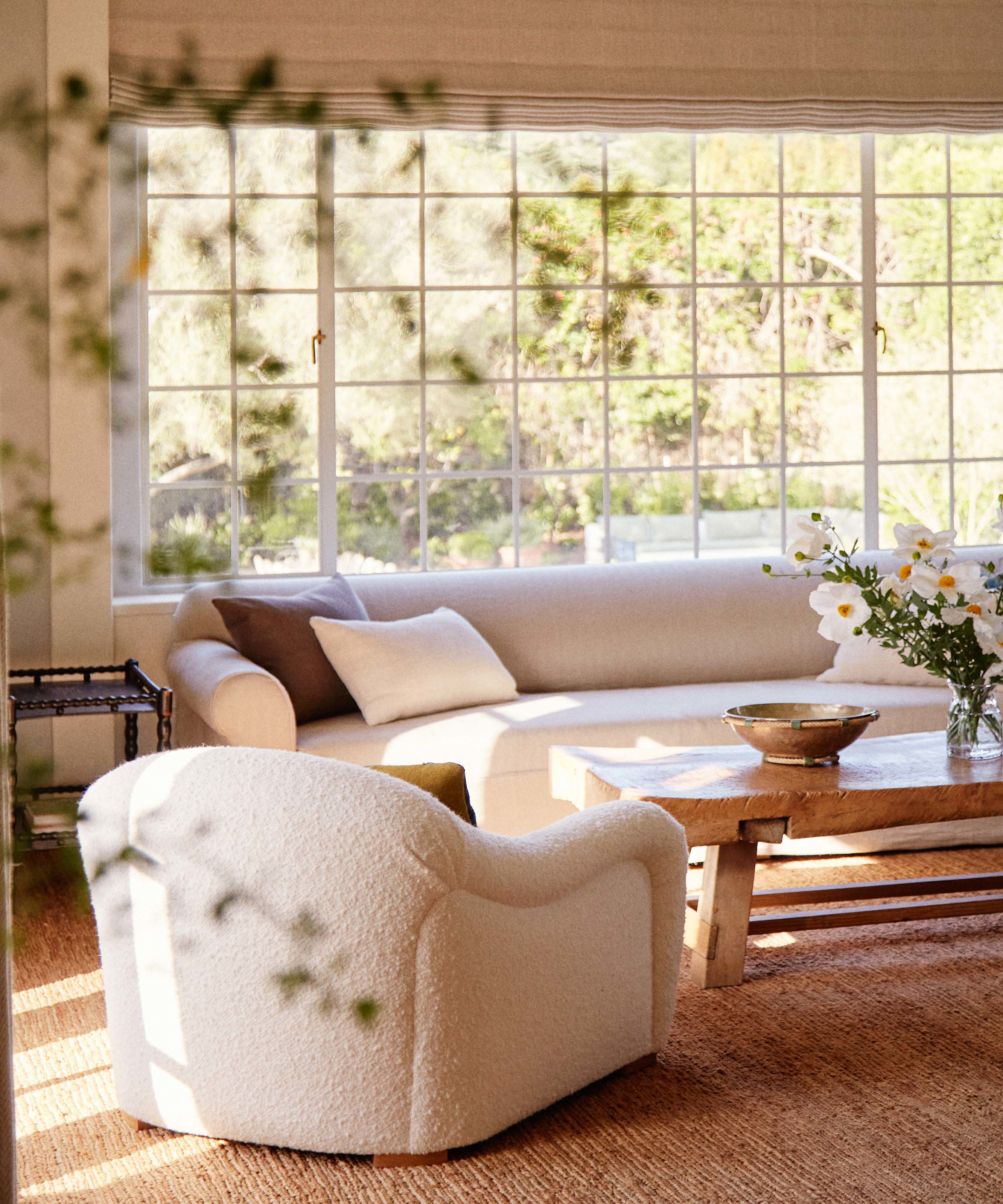 a living room filled with furniture and a window