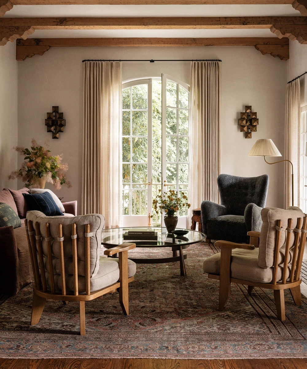 a living room filled with furniture and a fire place