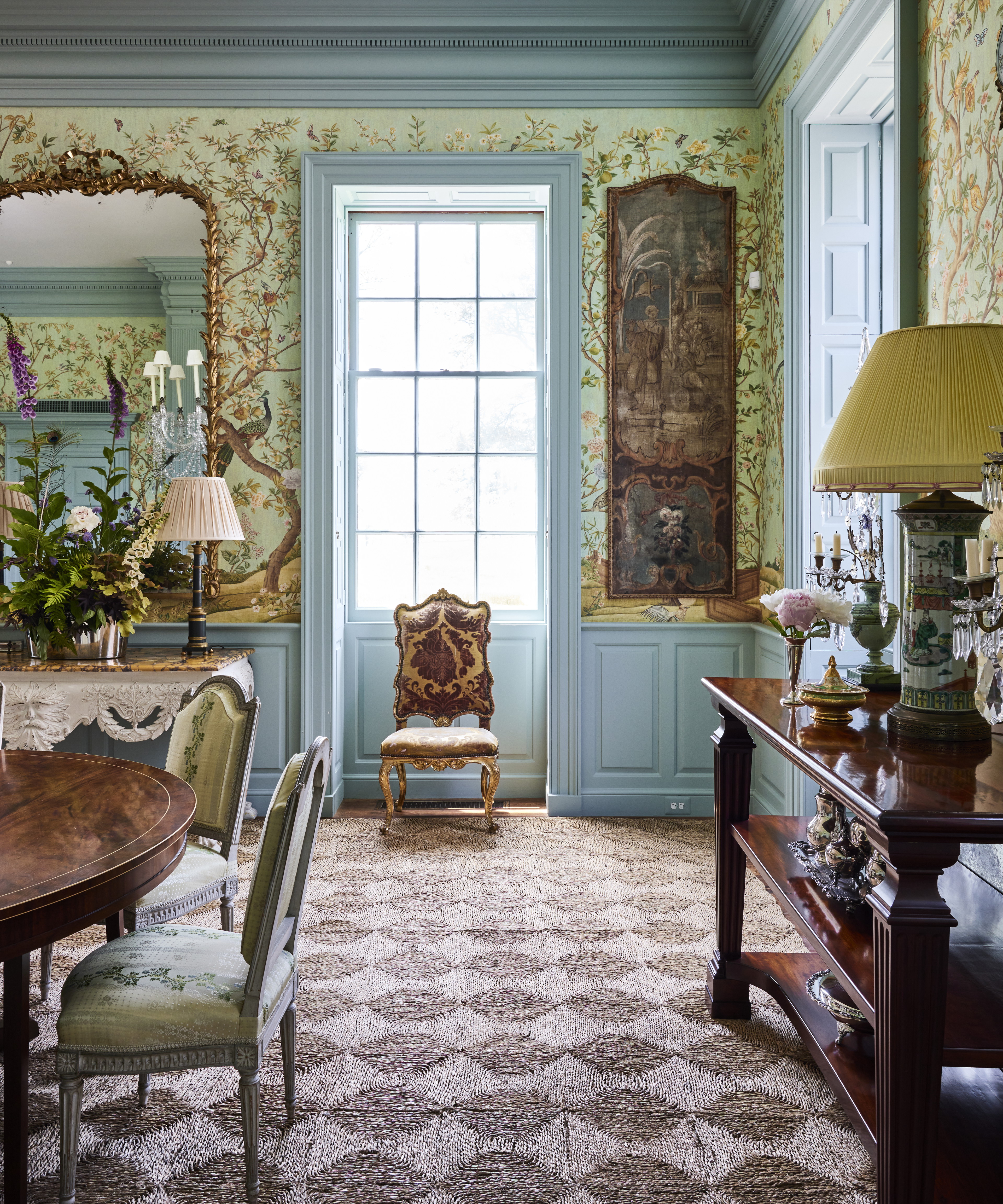 a dining room with a table and chairs