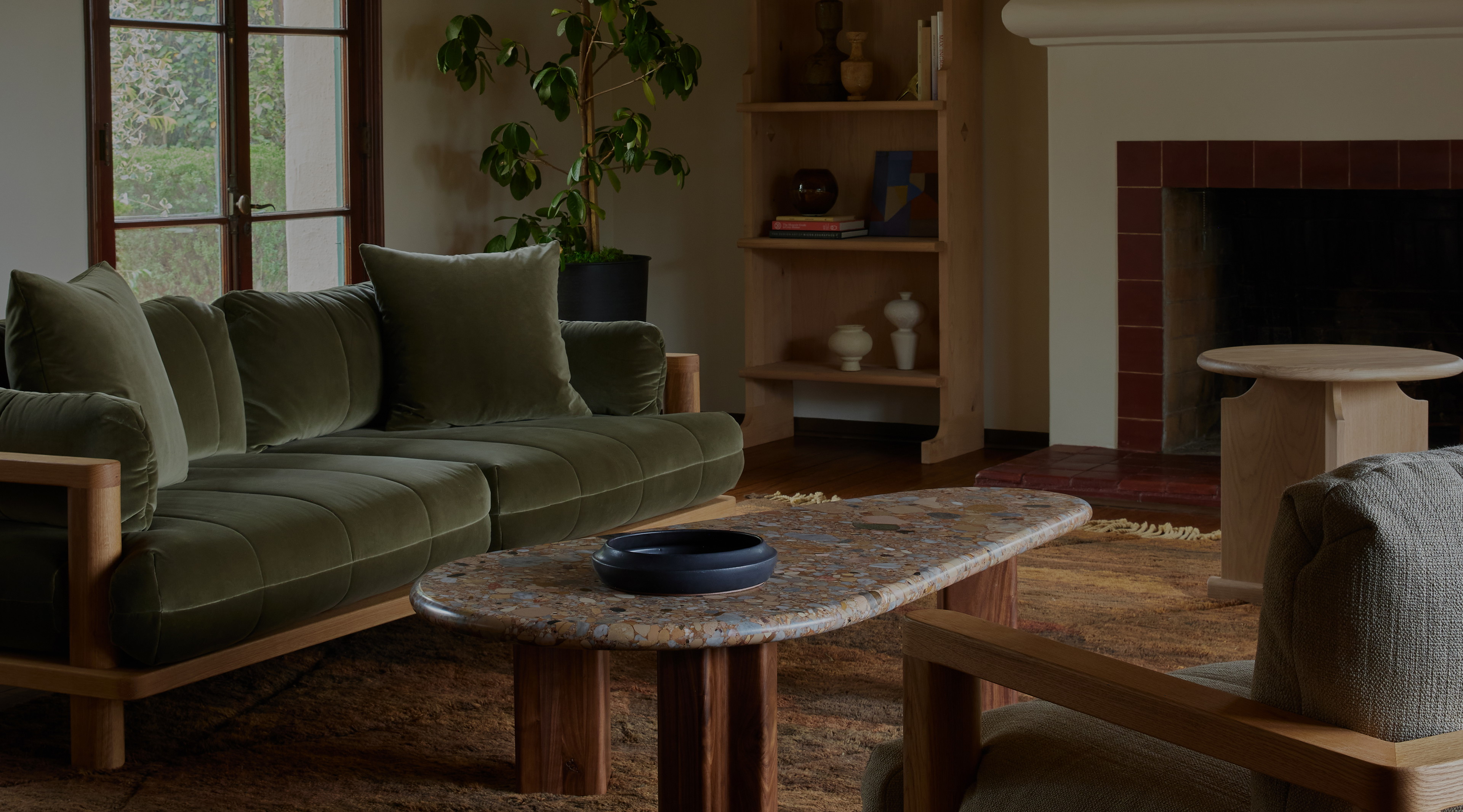 a living room filled with furniture and a fire place