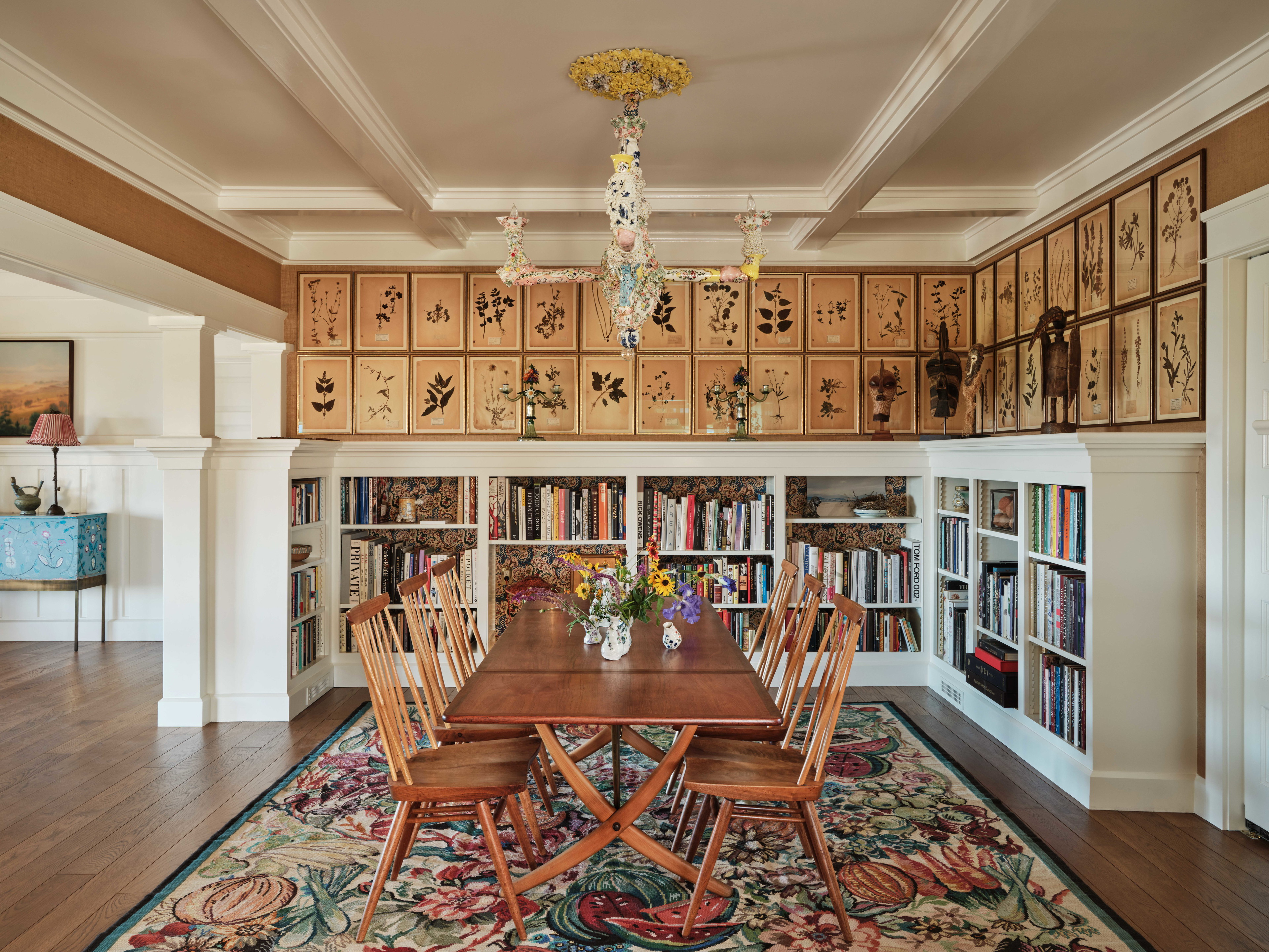 a dining room with a table and chairs