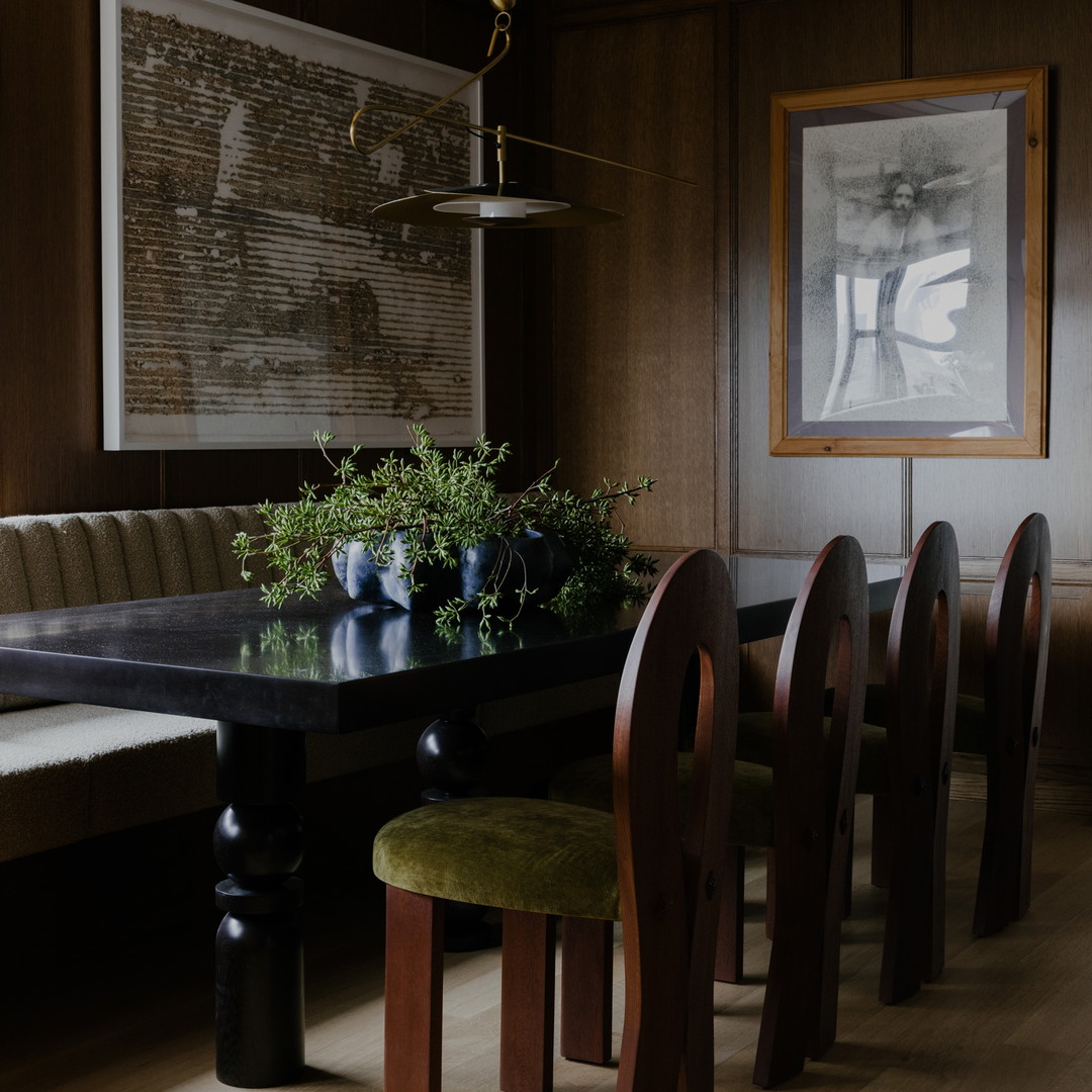 a dining room with a table and chairs