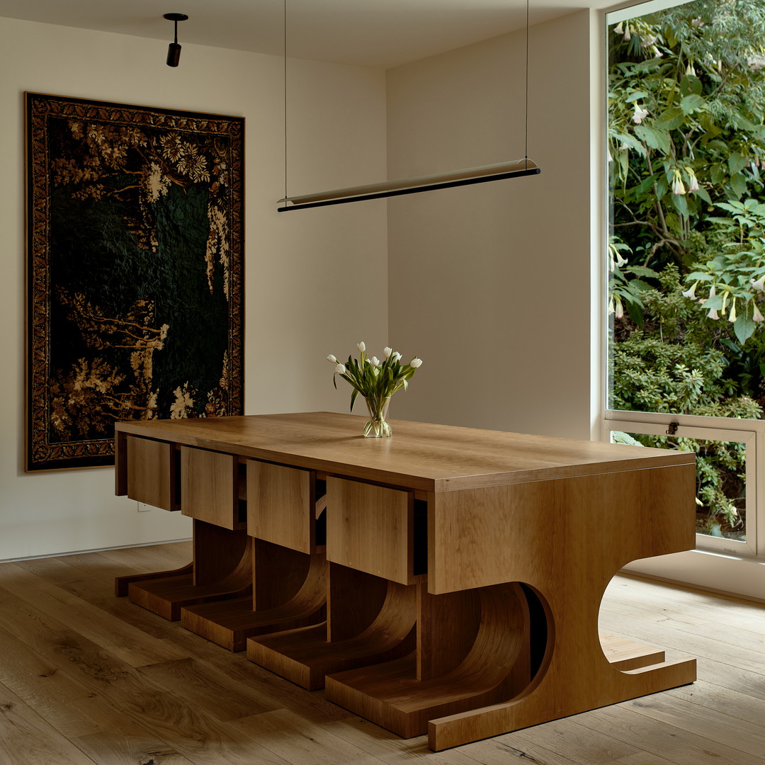 a wooden table with a vase of flowers on top of it