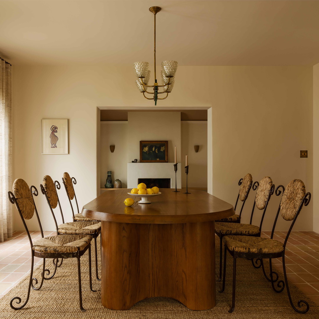 a dining room table with chairs around it