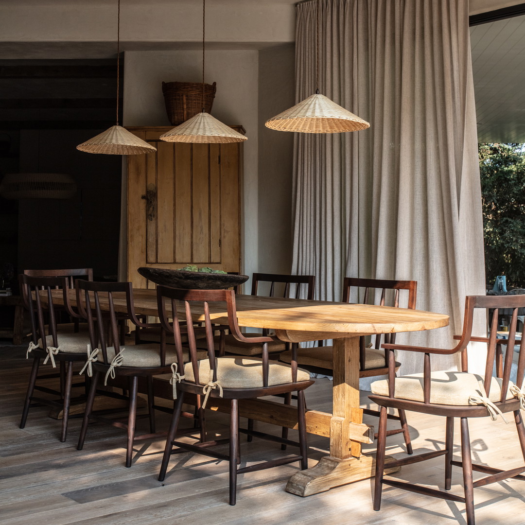 a dining room with a table and chairs