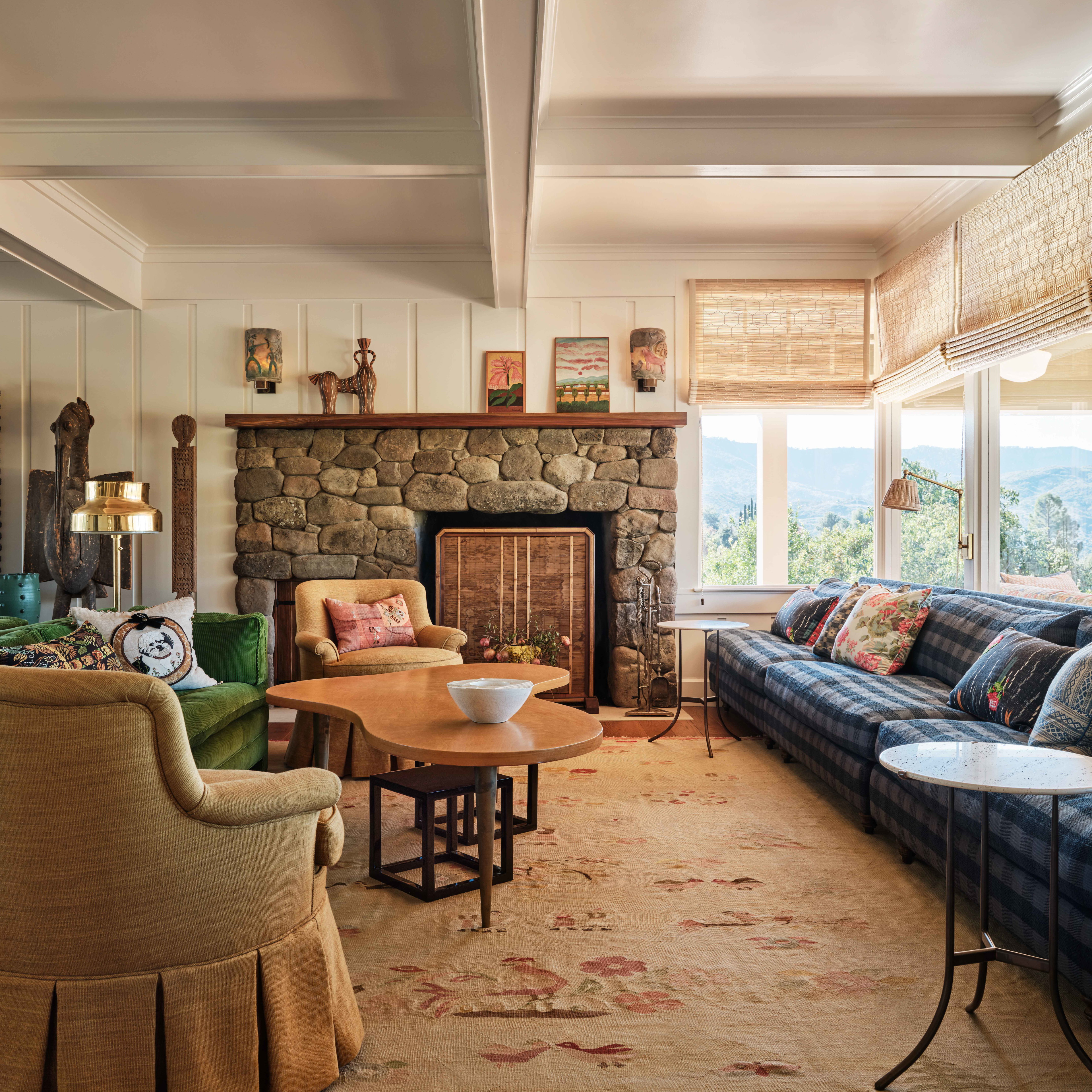 a living room filled with furniture and a fire place