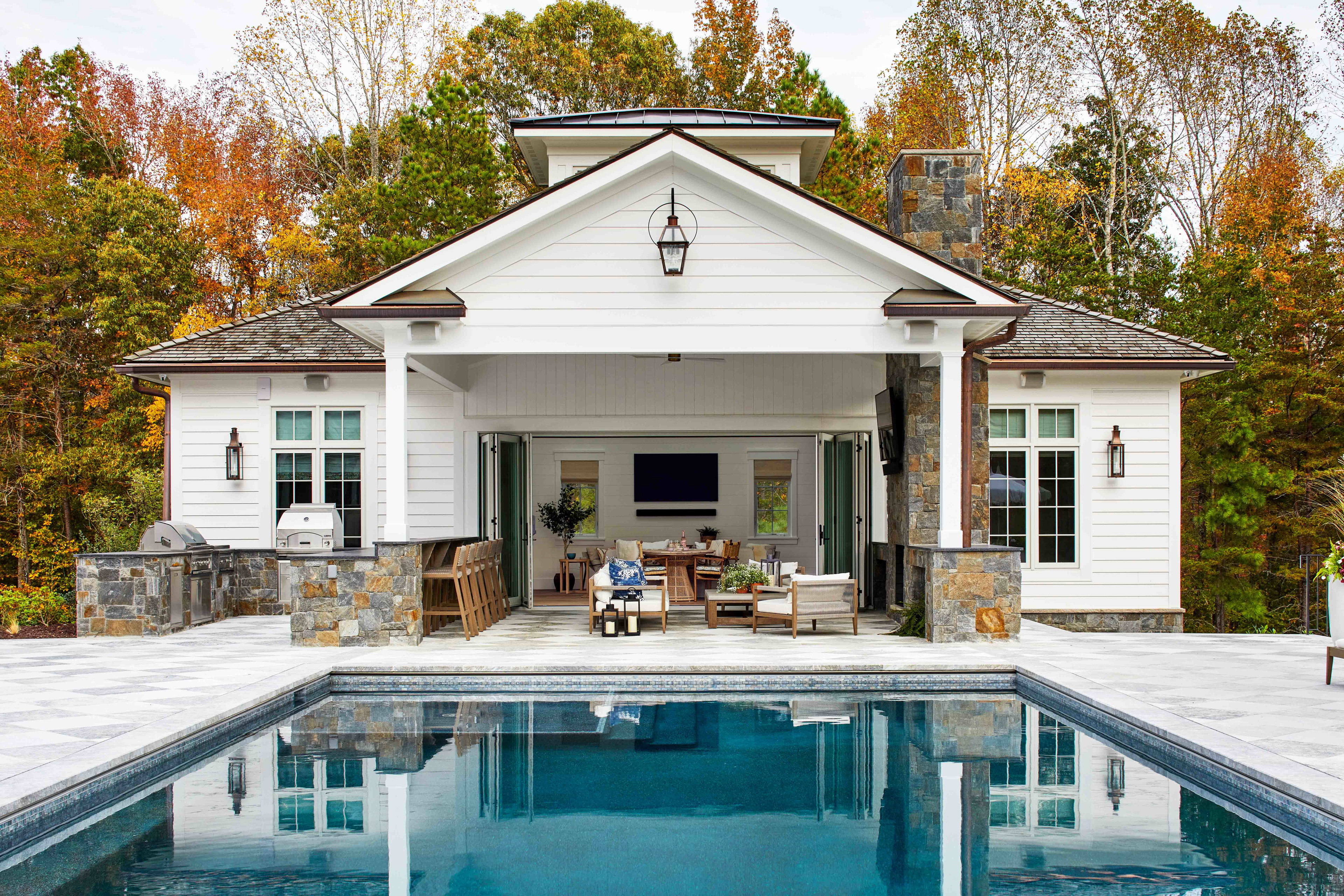 a house with a pool in the middle of it