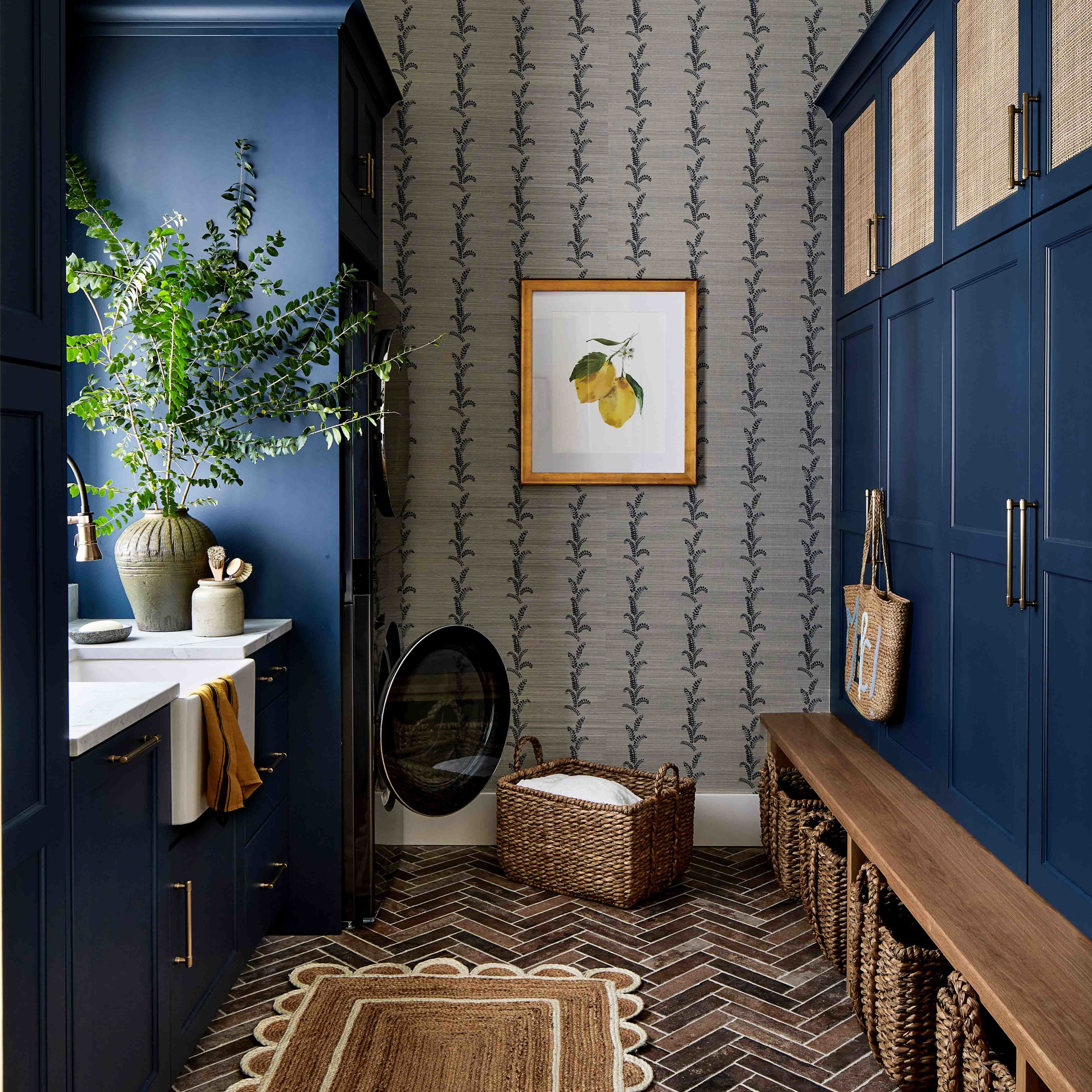 a hallway with blue cabinets and a rug on the floor