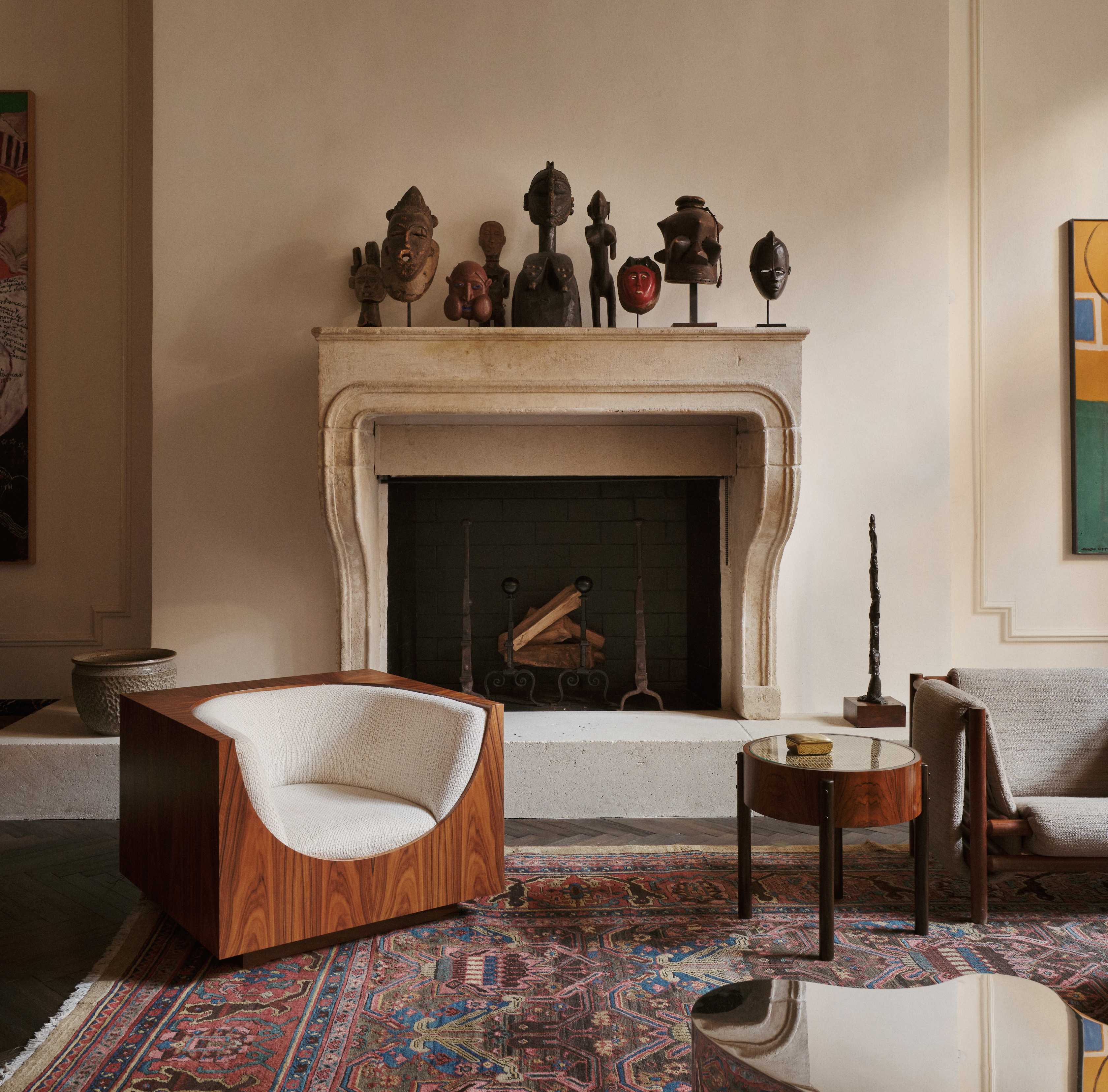 a living room filled with furniture and a fire place