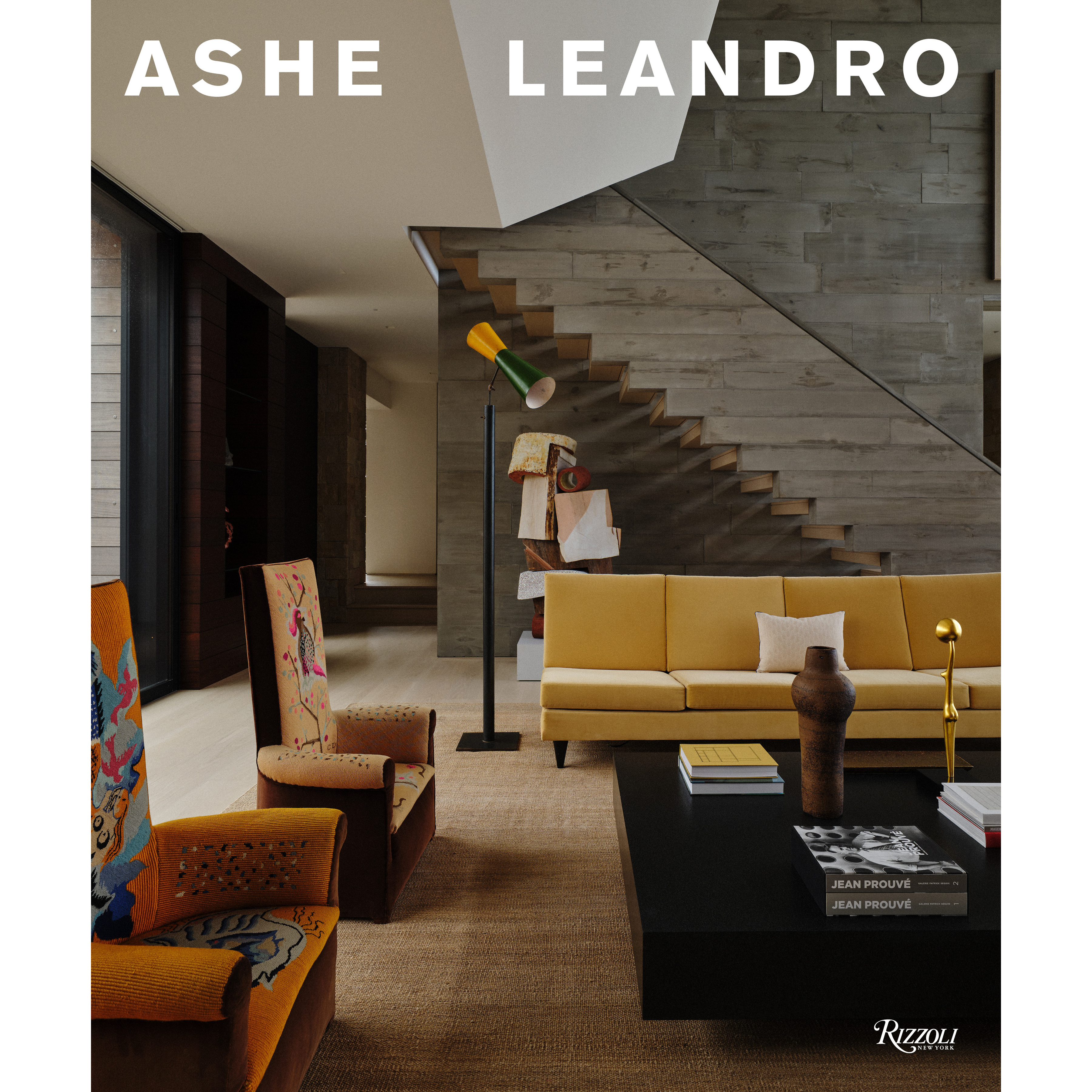 a living room filled with furniture and a stair case