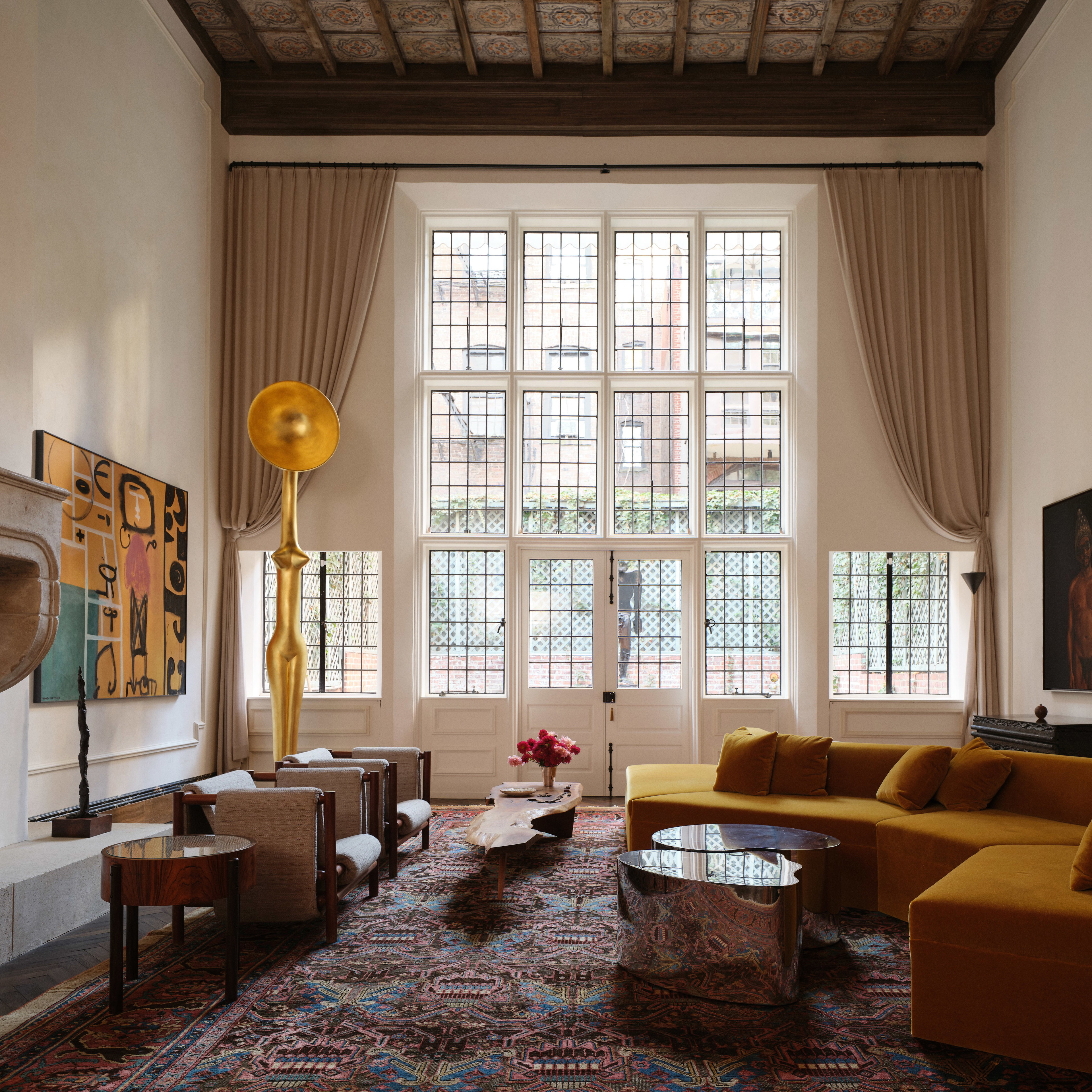 a living room filled with furniture and a fire place