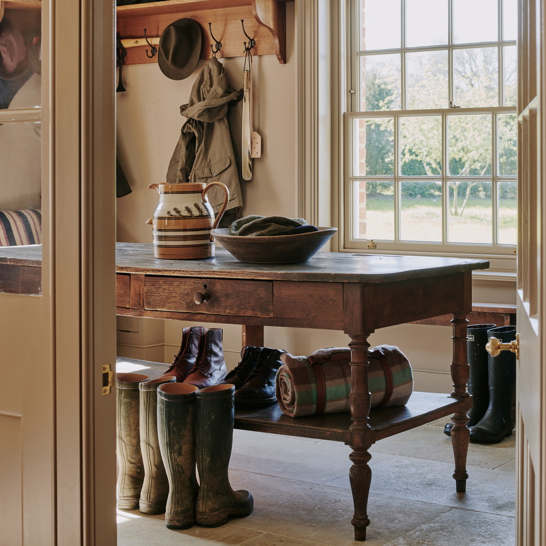 a room with a table and some boots