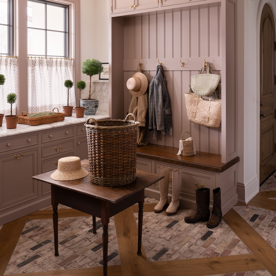 a room with a bench and a basket on a table