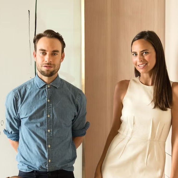 a man and a woman standing next to each other