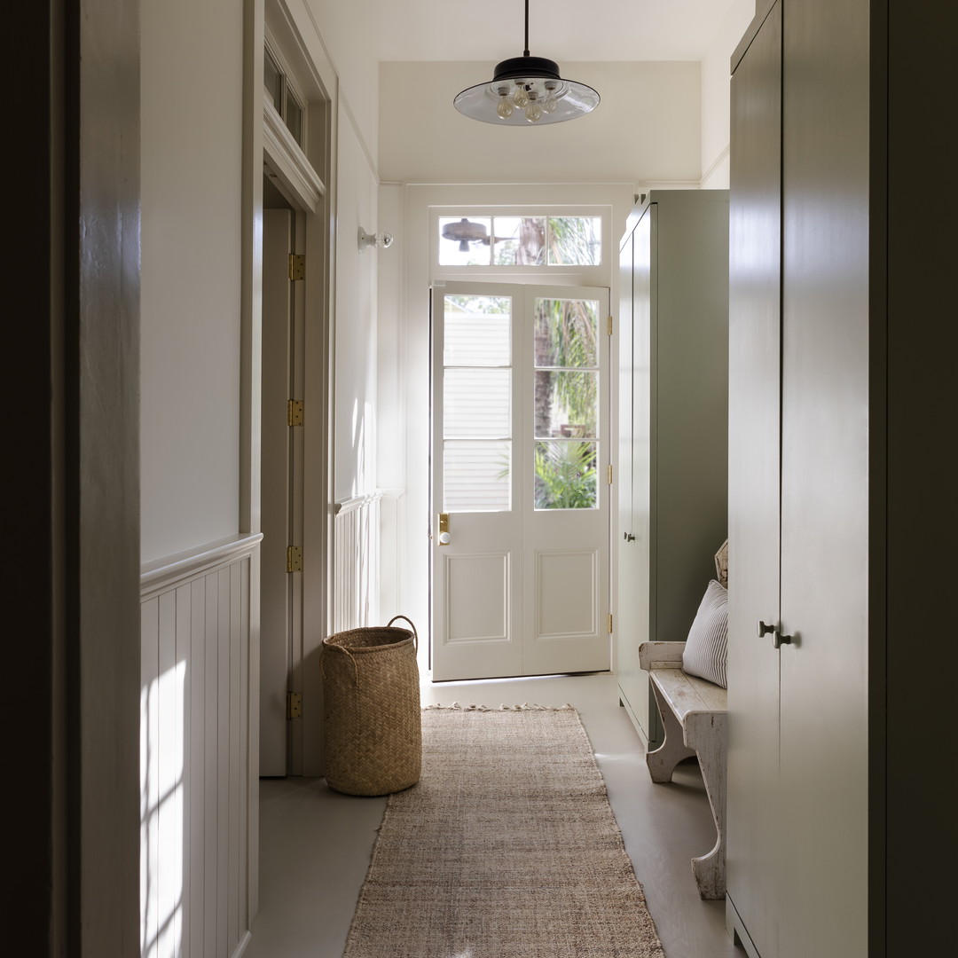 a long hallway with a rug on the floor