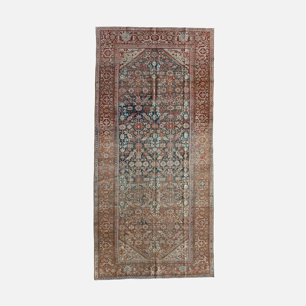 an antique persian rug with an intricate design