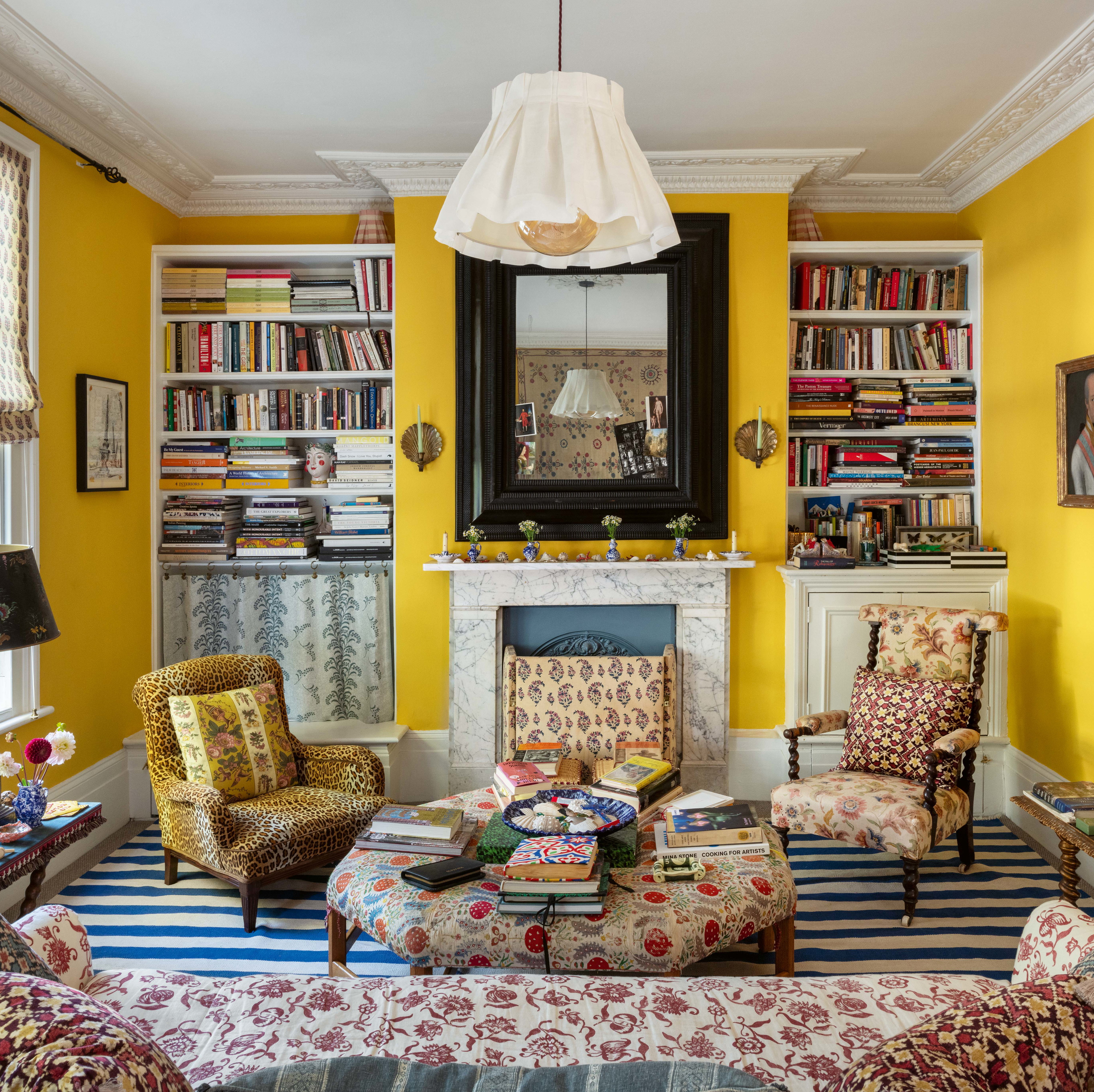 a living room filled with furniture and a fire place