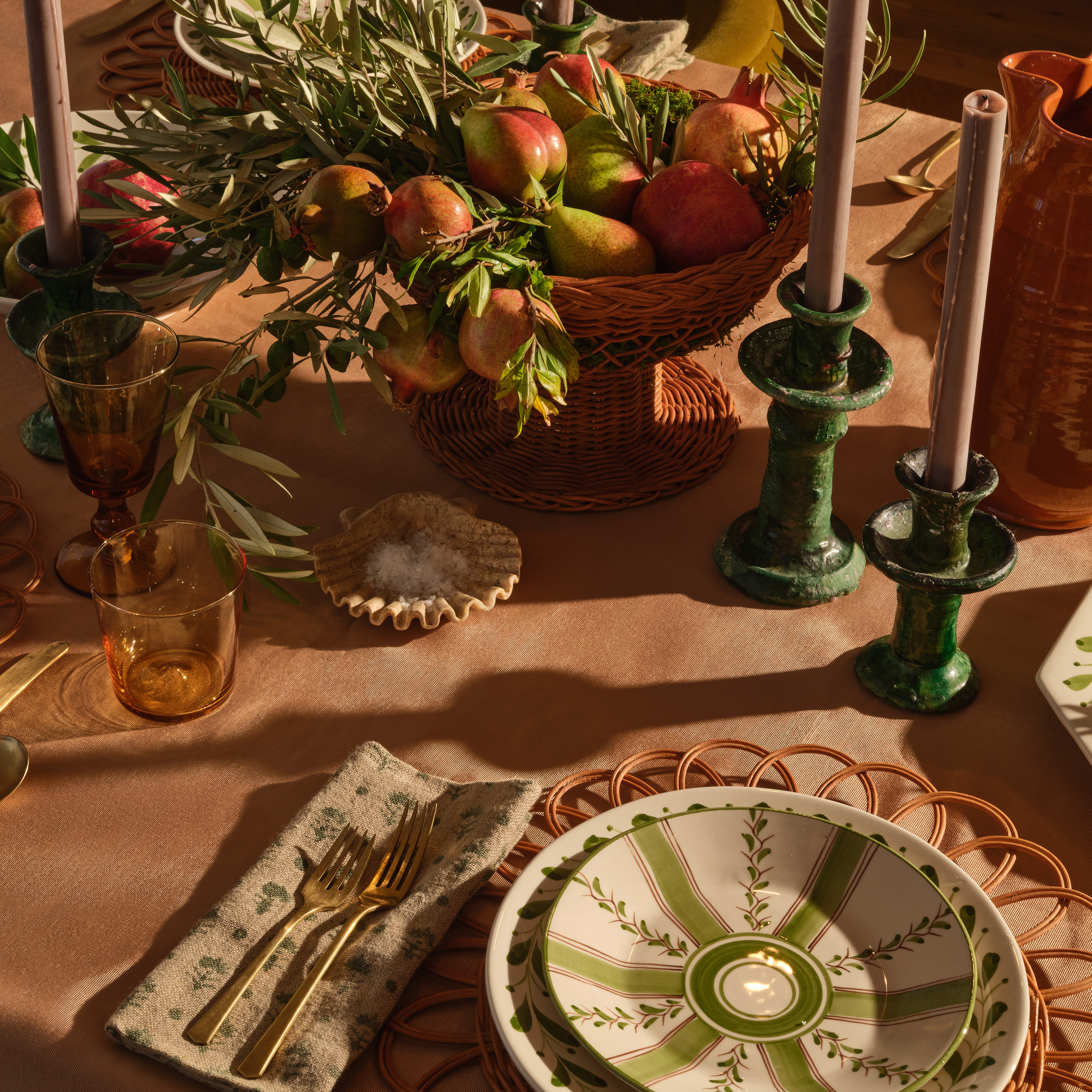 a table topped with plates and bowls of food