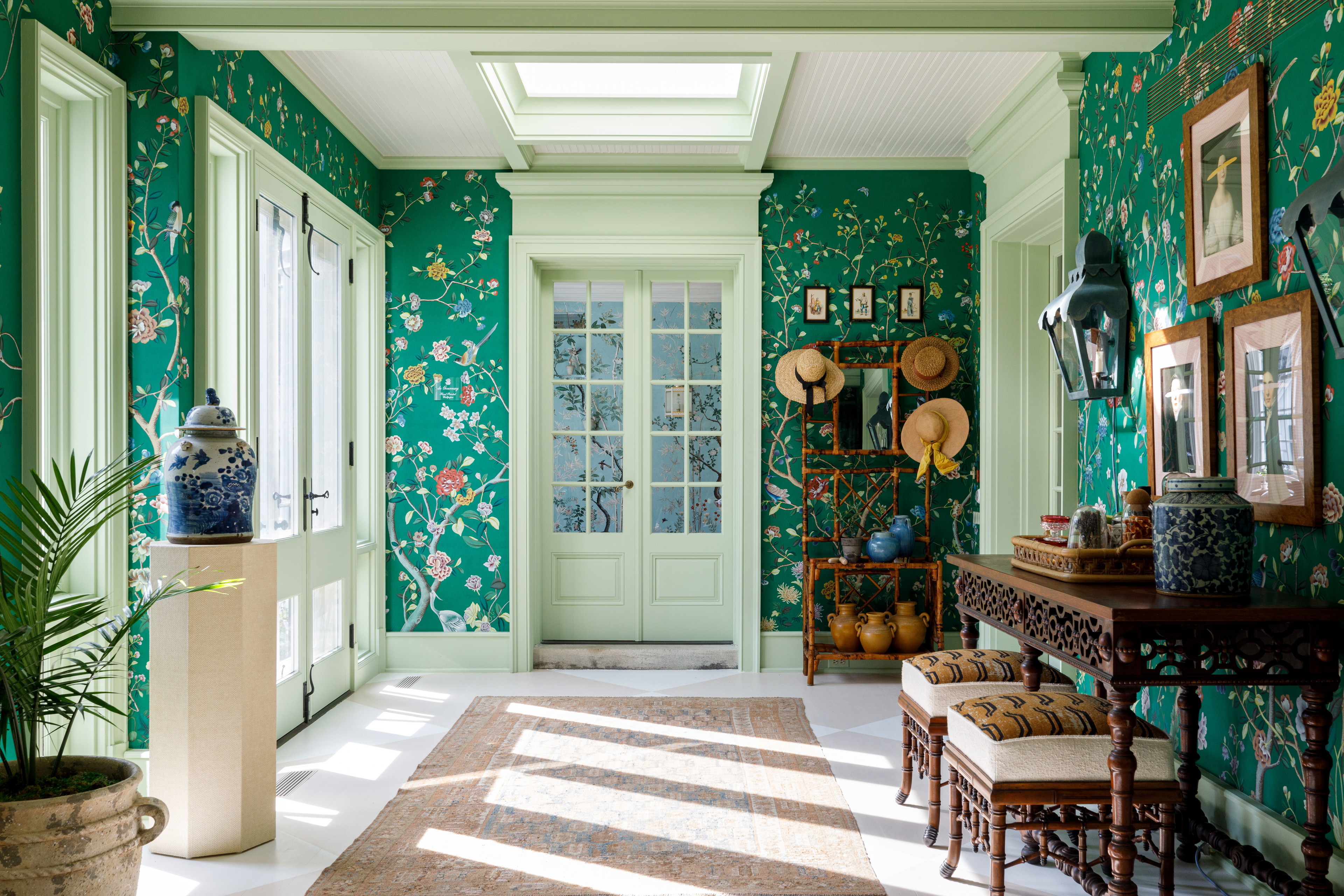 a room with green walls and a white ceiling