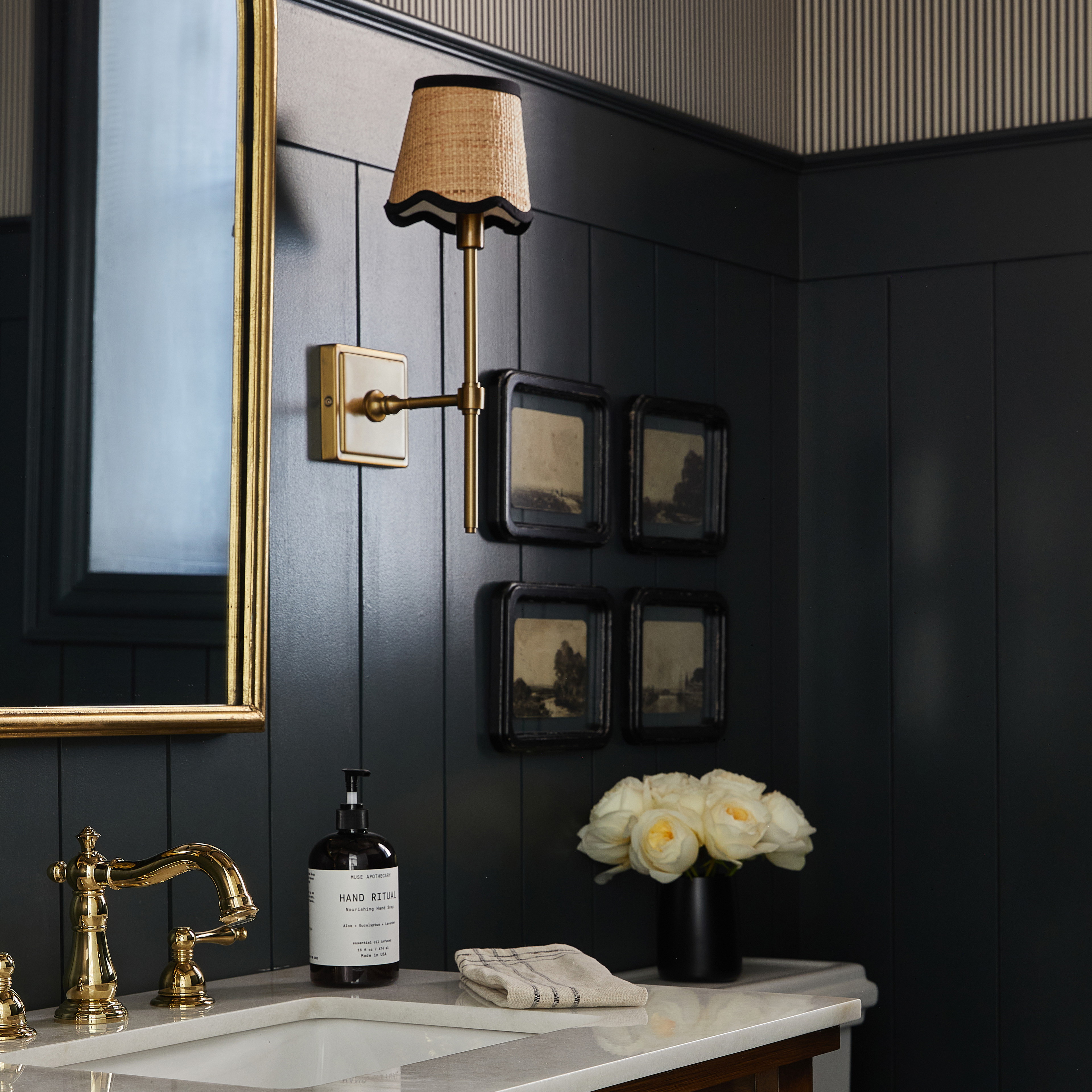 a bathroom with a sink, toilet and a mirror