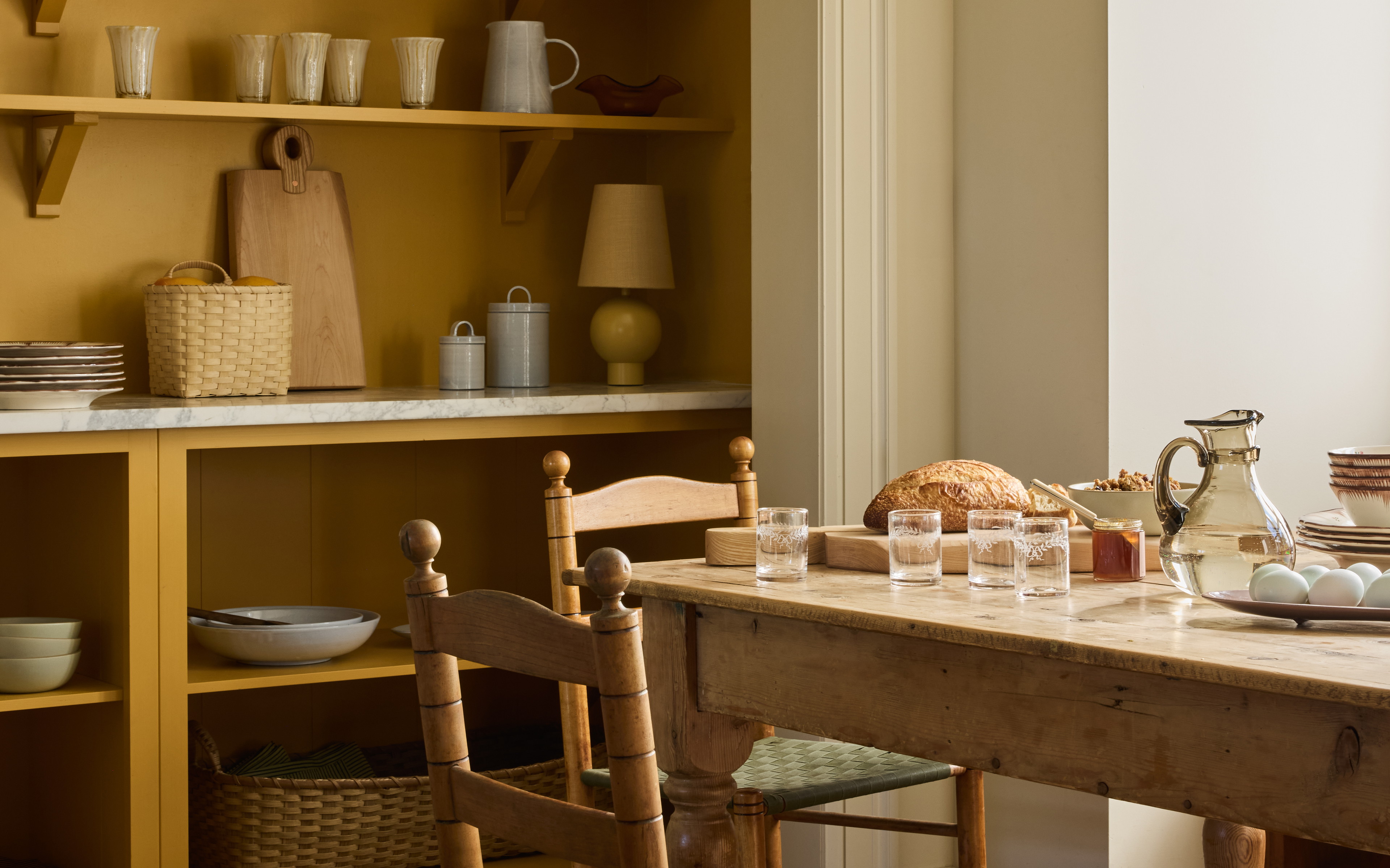 a dining room with a table and chairs