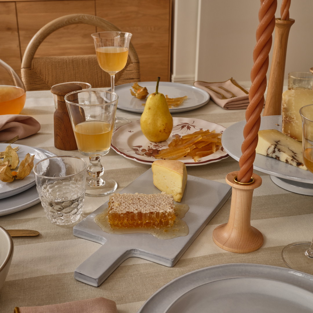 a table with plates and glasses of wine