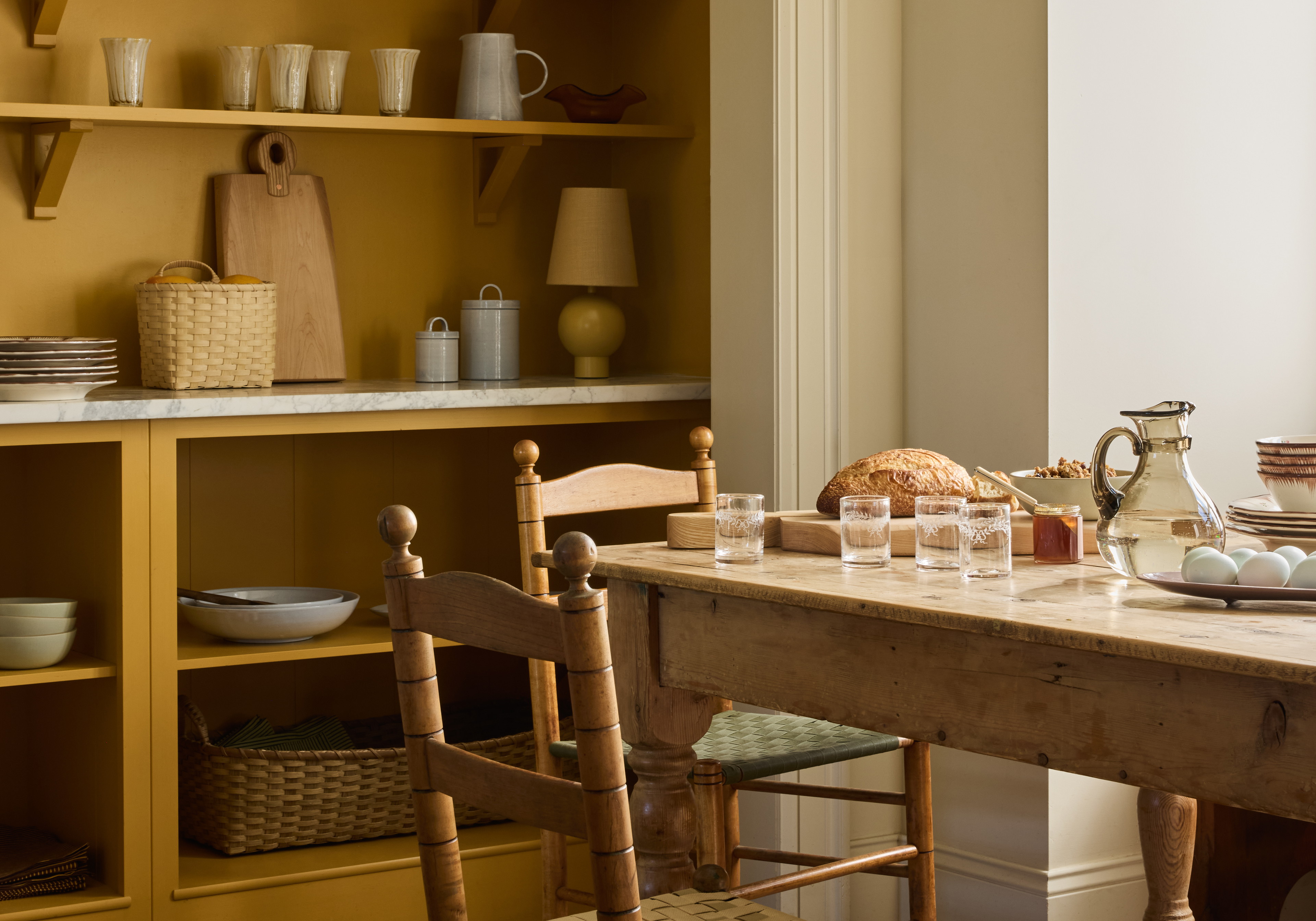 a dining room with a table and chairs