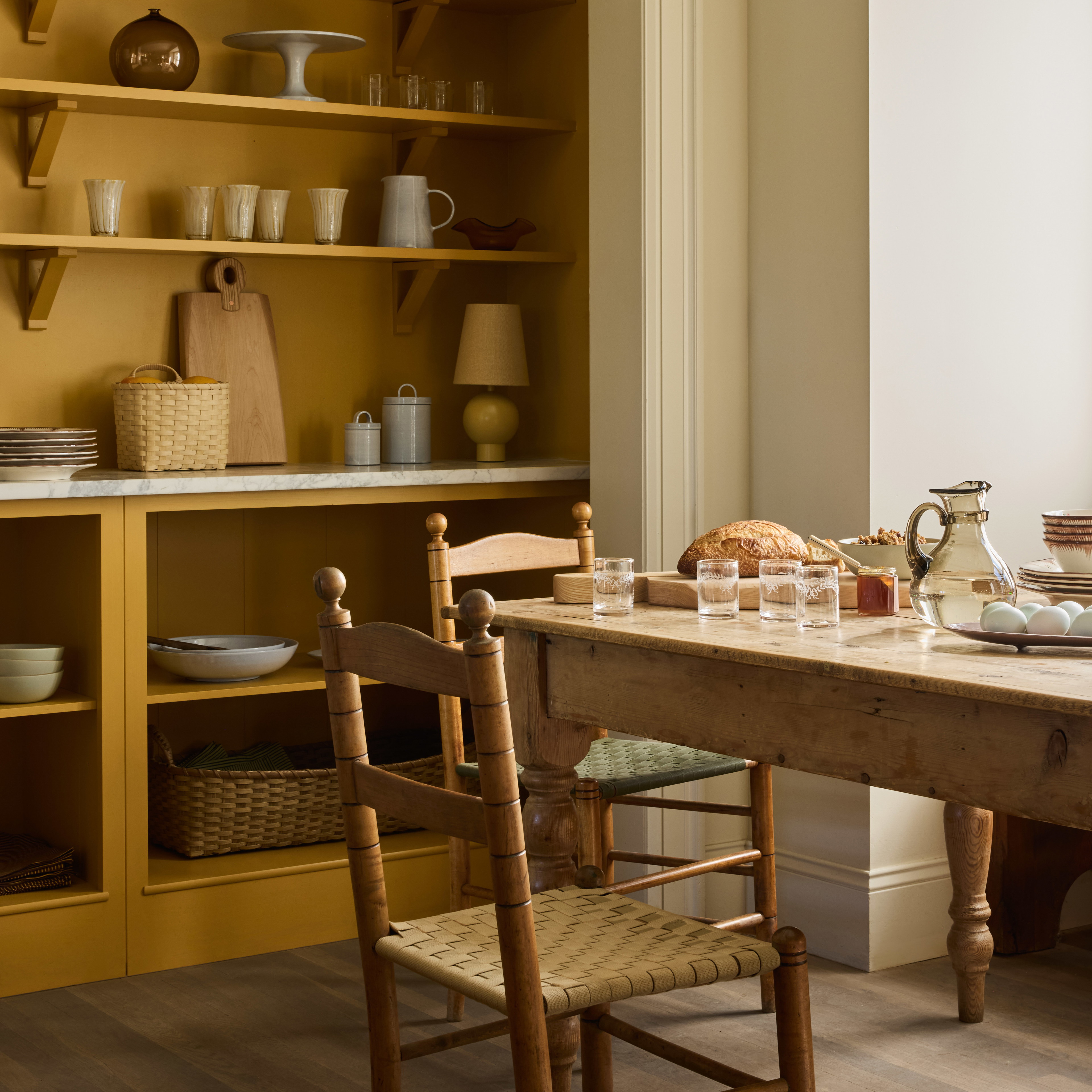 a dining room with a table and chairs