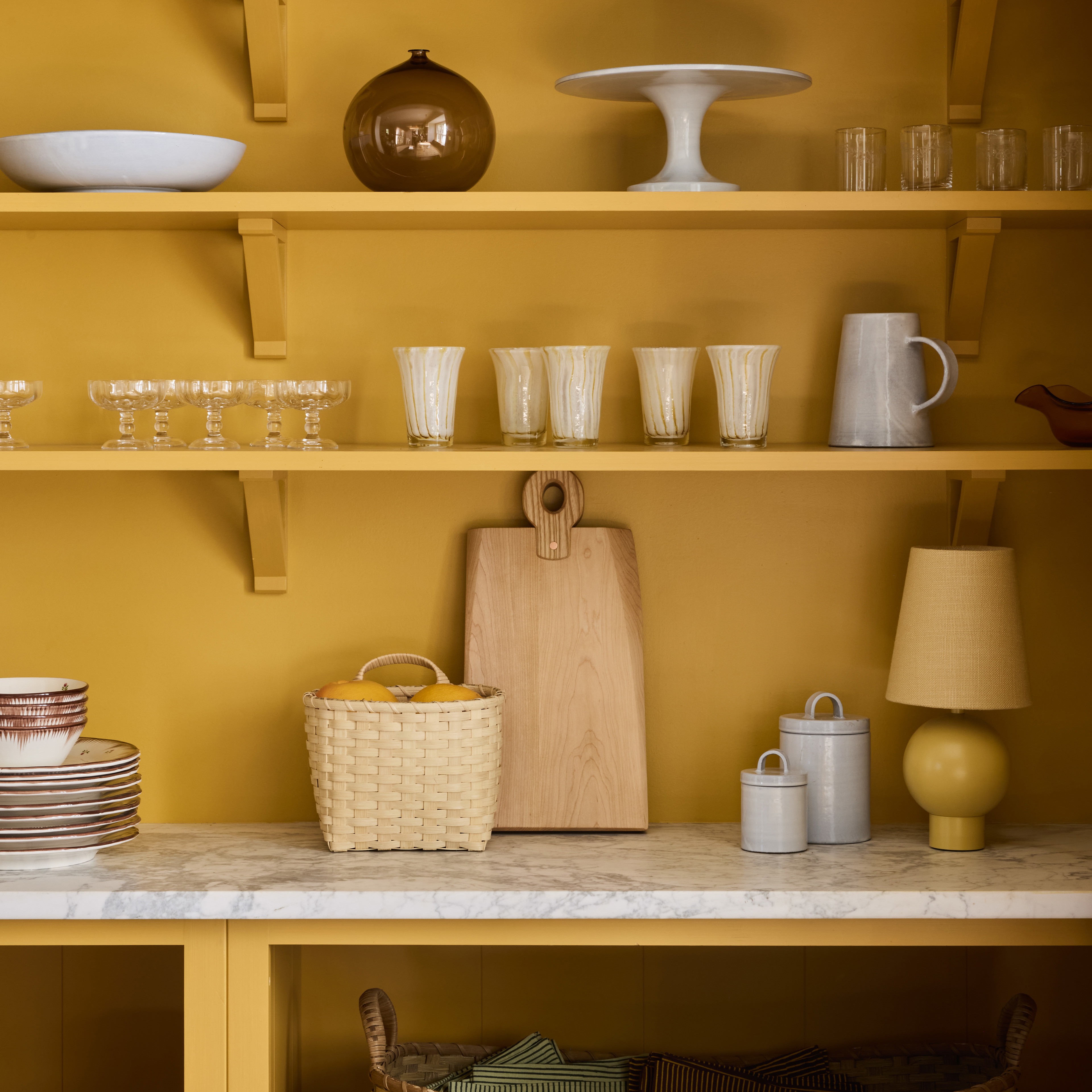 a shelf filled with lots of dishes and cups